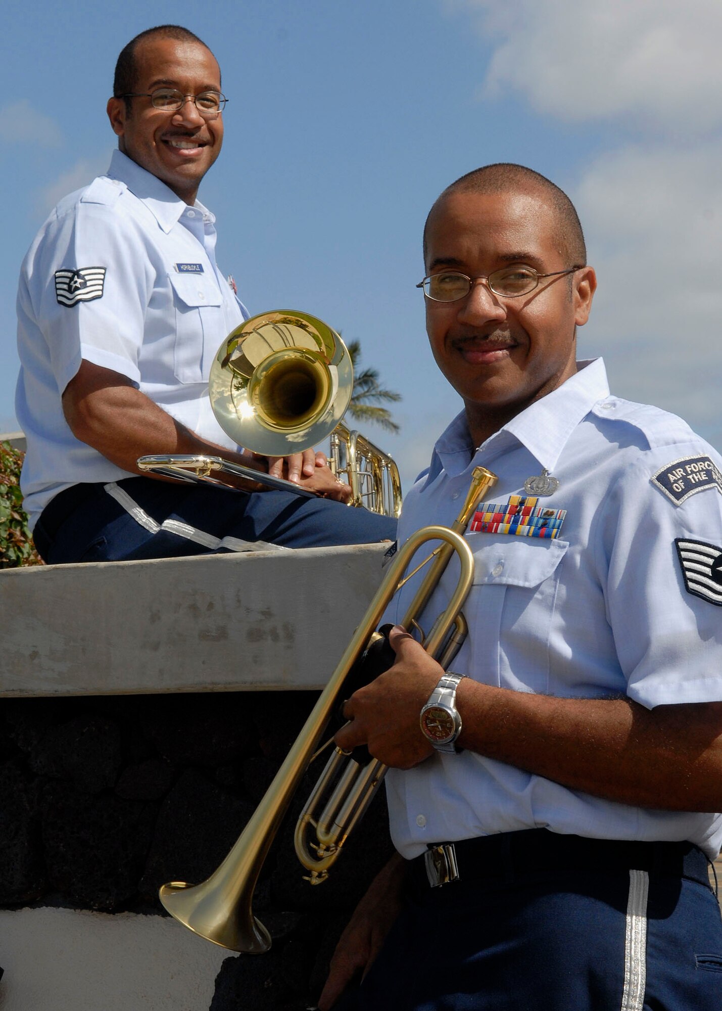 Trumpet player, Tech. Sgt. Brian Hornbuckle, joined his identical twin brother, trombone player, Tech. Sgt. Michael Hornbuckle, as a member of the Band of the Pacific, Hickam Air Force Base, Hawaii, Feb. 17, 2010.  This is the twins second time being assigned together since leaving home and joining the Air Force together.  Sergeant Brian?s arrival makes them the only pair of identical twins to performing in an Air Force band together. (U.S. Air Force photo/Tech. Sgt Jerome S. Tayborn)