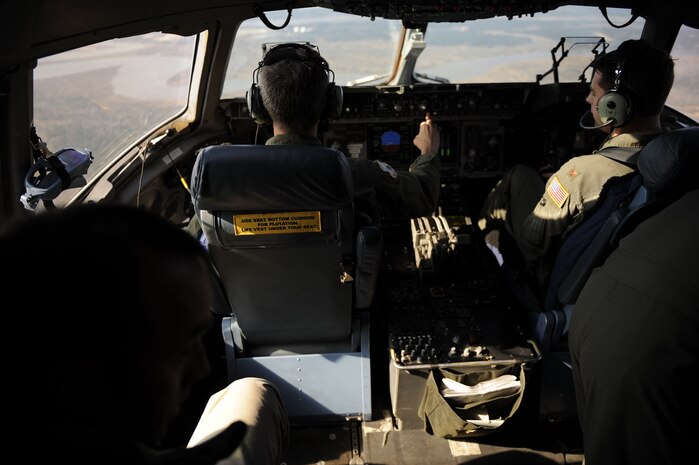 Col. Steven Chapman, 315th Airlift Wing commander, and Maj. Brian Moritz, 16th Airlift Squadron pilot, fly a C-17 Globemaster III around Charleston, S.C., Feb. 25, 2010. The flight was the first to take off and land on runway 03/21 after a $30 million reconstruction project. Because of the construction, larger and heavier aircraft will now be cleared to land on runway 03/21. (U.S. Air Force photo by Staff Sgt. Eric Harris/Reviewed)