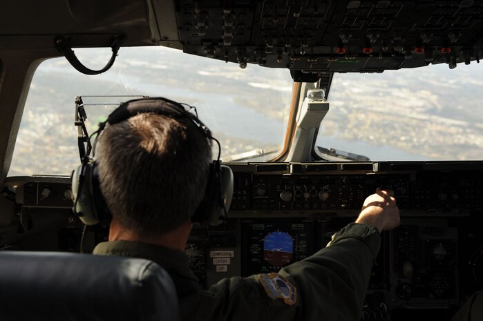 Col. Steven Chapman, 315th Airlift Wing commander, flies a C-17 Globemaster III around Charleston, S.C., Feb. 25, 2010. The flight was the first to take off and land on runway 03/21 after a $30 million reconstruction project. The runway will now have new edge lighting, distance remaining markers and runway end indicator lights on both ends. (U.S. Air Force photo by Staff Sgt. Eric Harris/Reviewed)