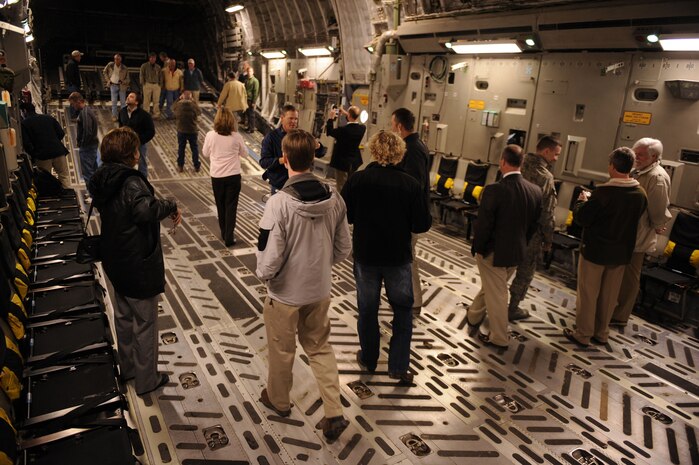 Passengers on a C-17 Globemaster III look around the aircraft before their flight from runway 03/21 at Joint Base Charleston, S.C., Feb. 25, 2010. The flight was the first to take off and land on runway 03/21 after a $30 million dollar reconstruction project. (U.S. Air Force photo by Staff Sgt. Eric Harris/Reviewed)