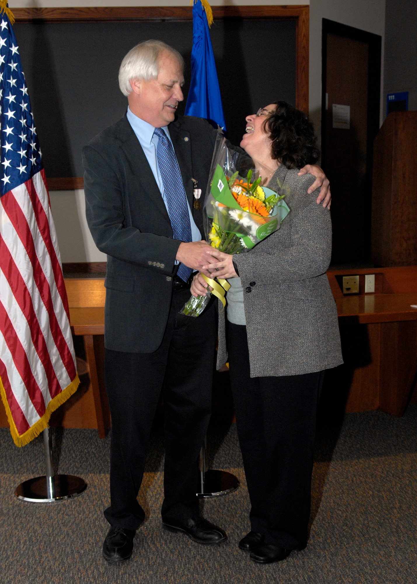 VANDENBERG AIR FORCE BASE, Calif. – Enjoying the moment with his wife Susan, David Rentschler, the former 30th Operations Group technical director, retired after 30 years here Thursday, Feb. 25, 2010. Mr. Rentschler filled many critical roles at Vandenberg helping the 30th Space Wing’s efforts in reengineering the Western Range. (U.S. Air Force photo/Airman 1st Class Lael Huss)