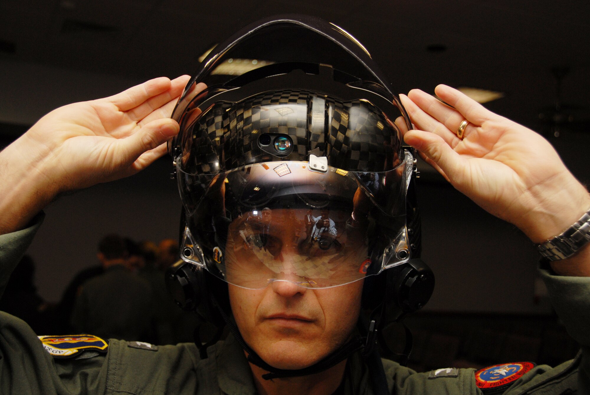 EGLIN AIR FORCE BASE, Fla. -- Navy Capt. Mike Saunders, 33rd Operations Group deputy commander, tries on the new F-35 Joint Strike Fighter helmet after getting measured for the new flight suit. The new pilot equipment includes everything from underwear to cold weather outer gear to anti-G garments. The measurement brought Eglin one step closer to being able to commence training, said Marine Col. Arthur Tomassetti, 33rd Fighter Wing commander. (U.S. Air Force photo/ Airman 1st Class Anthony Jennings)