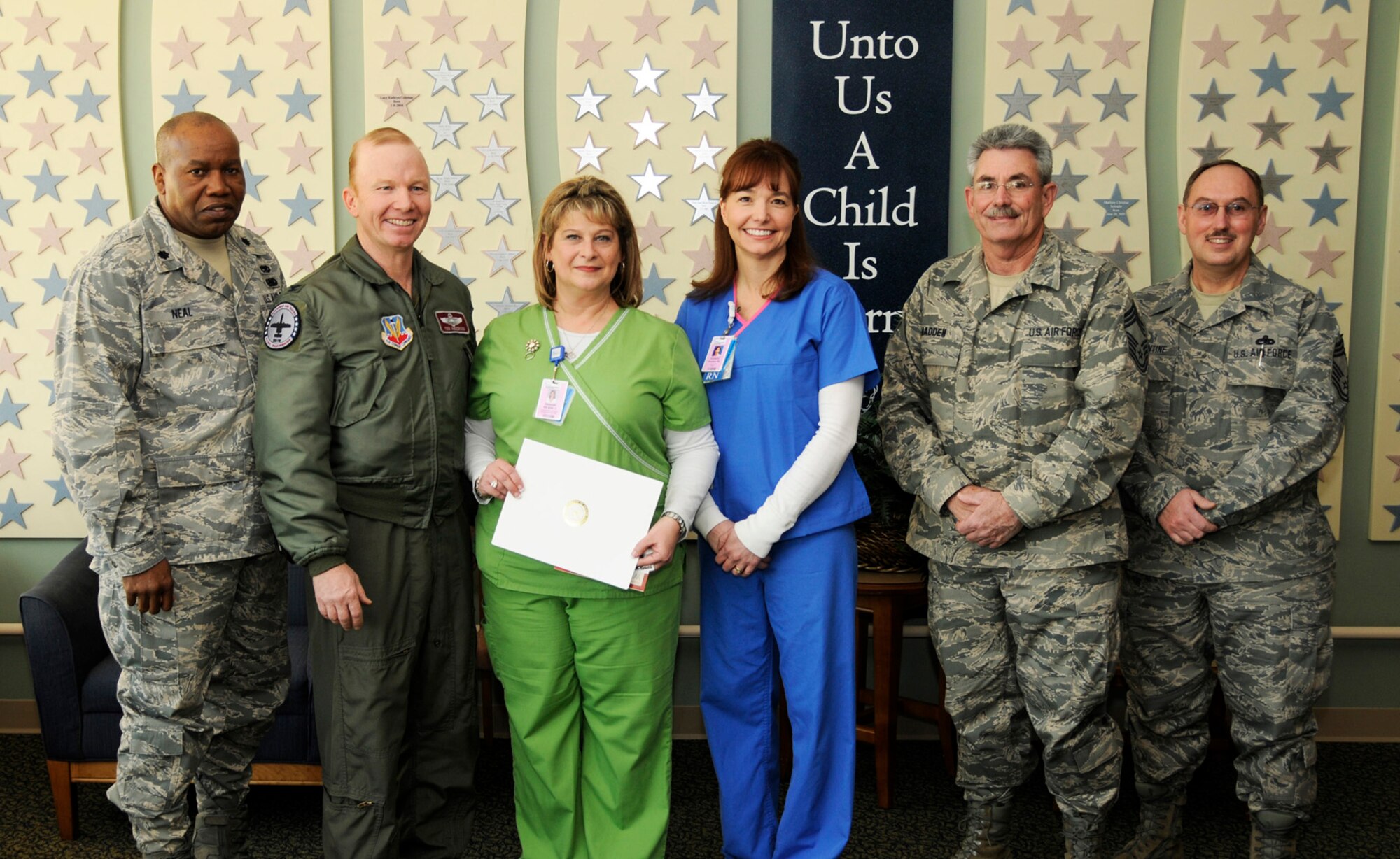 From left: Lt. Col. Anderson Neal; Col. Tom Anderson, 188th Fighter Wing commander; Debbie Bader, Patriot Award recipient and nurse manager at St. Edward Mercy Medical Center in Fort Smith, Ark.; Capt. Kim Sosebee, 188th maintenance officer and nurse at St. Edwards; Chief Master Sgt. Larry Madden; and Chief Master Sgt. Randy Barentine. Bader was nominated for a Patriot Award by her employee, Sosebee. Bader was presented the accolade Feb. 16 at St. Edwards. (U.S. Air Force photo by Senior Master Sgt. Dennis Brambl/188th Fighter Wing Public Affairs)