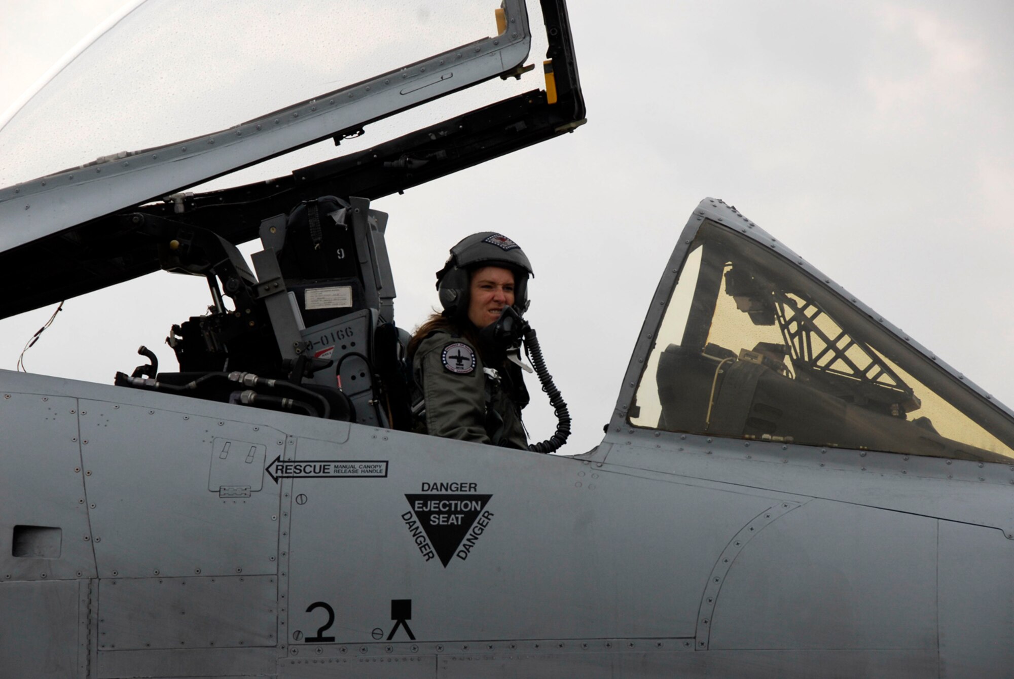 Capt. Kristin Bass prepares to exit an A-10C Thunderbolt II "Warthog" following her fini flight at the 188th Fighter Wing in Fort Smith, Ark., Oct. 6, 2008. Bass flew both F-16 Fighting Falcons and A-10s for the 188th and was the unit's first and lone female pilot. The 188th will celebrate Women's History Month March 6 during UTA with guest speaker, State Command Sgt. Major Deborah Collins at 9:30 a.m. in the 188th headquarters auditorium. (U.S. Air Force photo by Senior Master Sgt. Dennis Brambl/188th Fighter Wing Public Affairs)