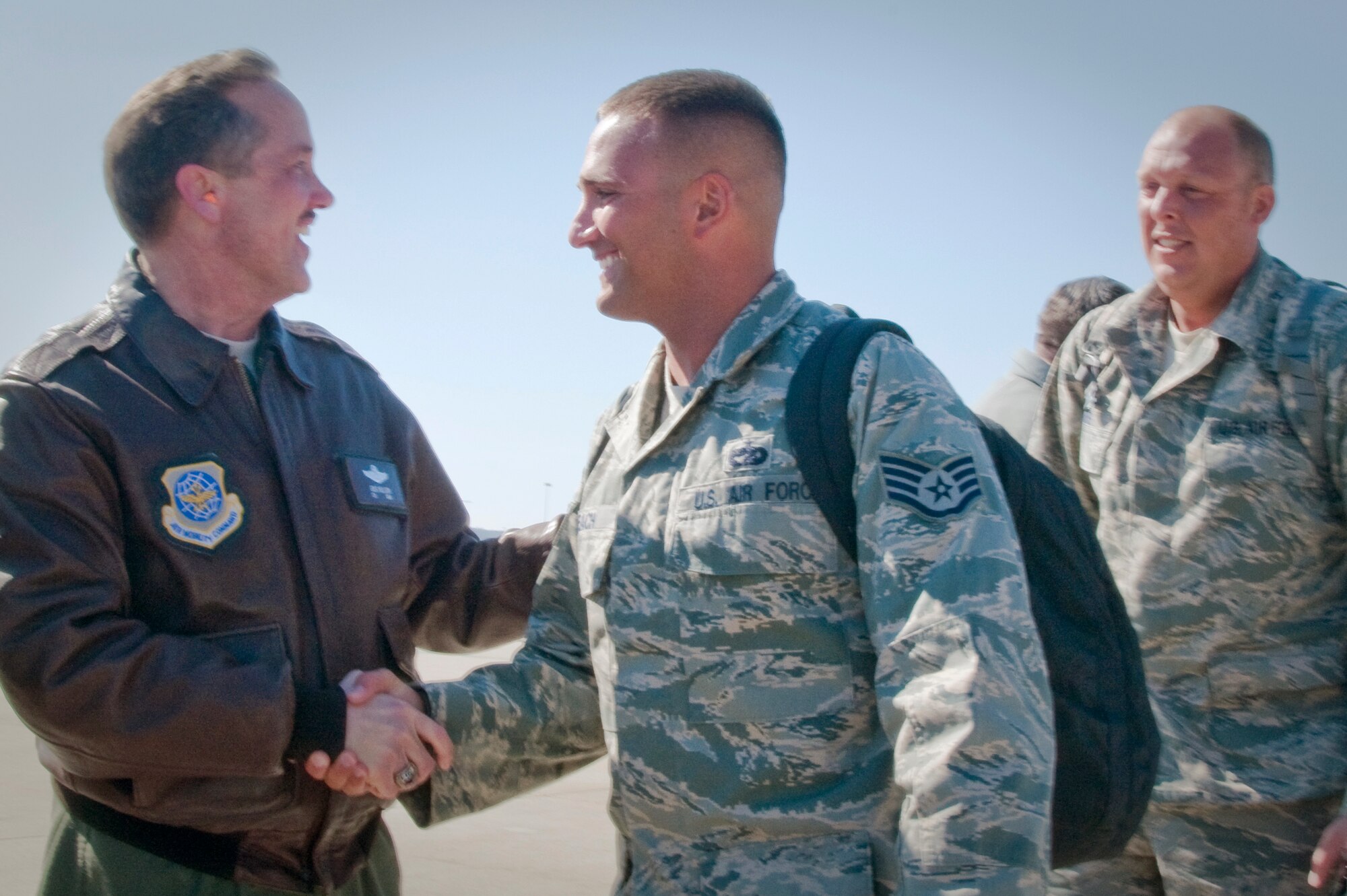 Col. Greg Nelson, commander of the Kentucky Air National Guard's 123rd Airlift Wing, welcomes home Staff Sgt. Brian Leach on Feb. 26 at the Kentucky Air Guard Base in Louisville, Ky. Sergeant Leach, of the 123rd Contingency Response Group, was returning from a five-week deployment to the Dominican Republic where he and about 45 other Kentucky Guardsmen were operating an air hub to distribute relief supplies for victims of the Jan. 12 earthquake in Haiti. (U.S. Air Force photo by Tech. Sgt. Philip Speck/Released)