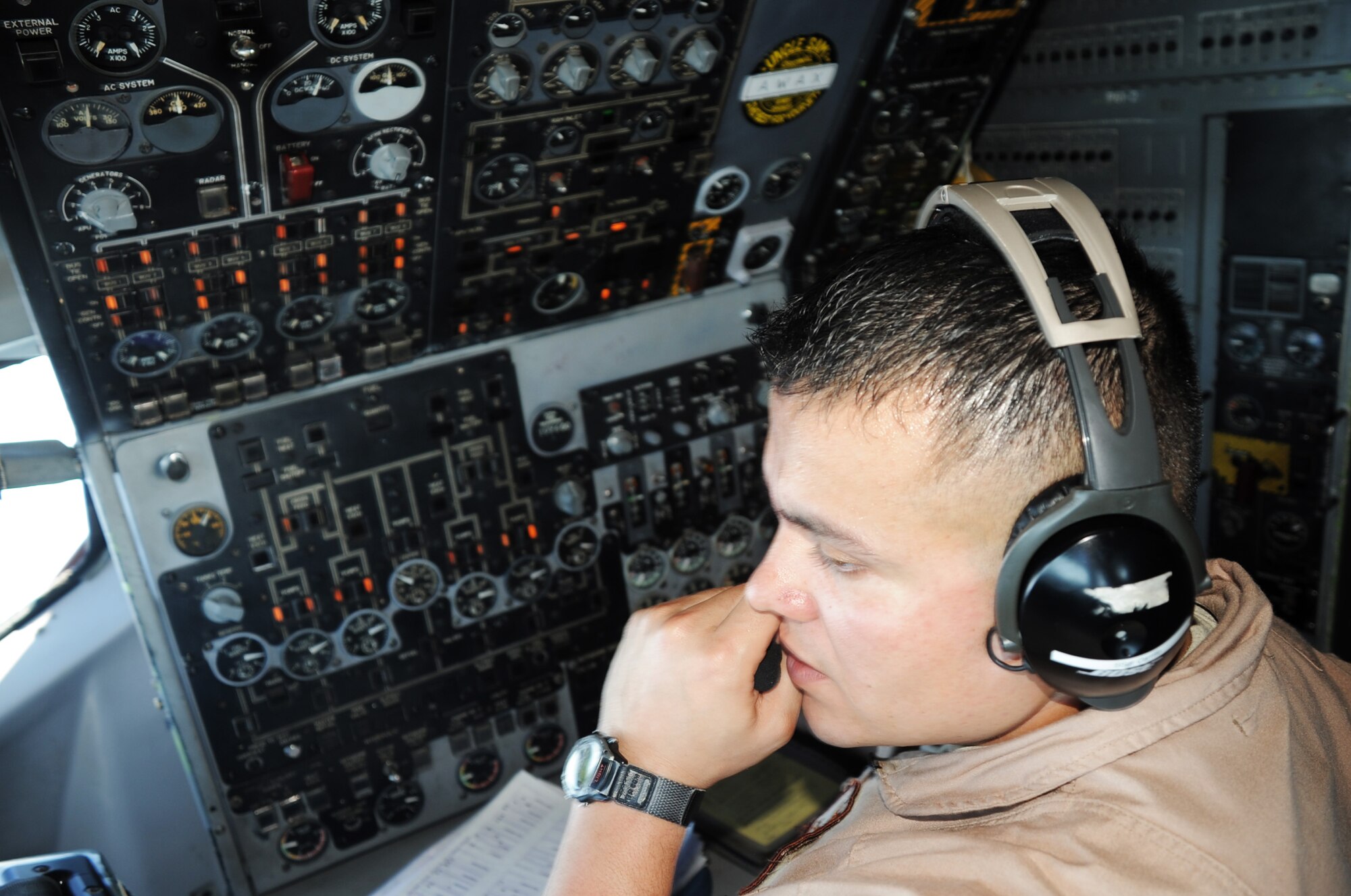Staff Sgt. Abel Carrillo, E-3 Sentry Airborne Warning and Control System aircraft flight engineer with the 965th Expeditionary Airborne Air Control Squadron at a non-disclosed base in Southwest Asia, works the flight engineer console of an E-3 while on a combat air mission Feb. 16, 2010. Sergeant Carrillo is deployed from Tinker Air Force Base, Okla., and his hometown is San Antonio, Texas. (U.S. Air Force Photo/Master Sgt. Scott T. Sturkol/Released)