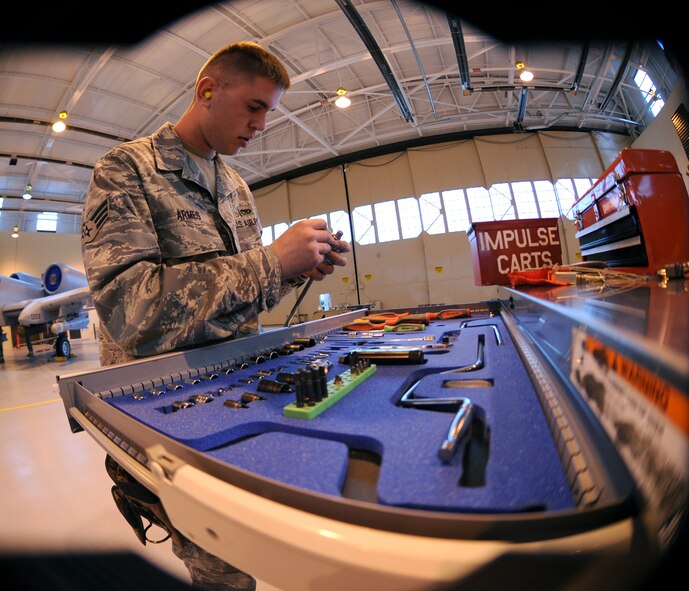 MOODY AIR FORCE BASE, Ga. -- Senior Airman Jarrod Armes, 74th Aircraft Maintenance Unit weapons load crew member, puts away his tools after loading munitions onto an A-10C Thunderbolt II during the 2009 Annual Load Crew Competition here Feb. 12. Each tool has its specific position in the tool box and fits into place like puzzle pieces. (U.S. Air Force photo by Airman 1st Class Benjamin Wiseman)
