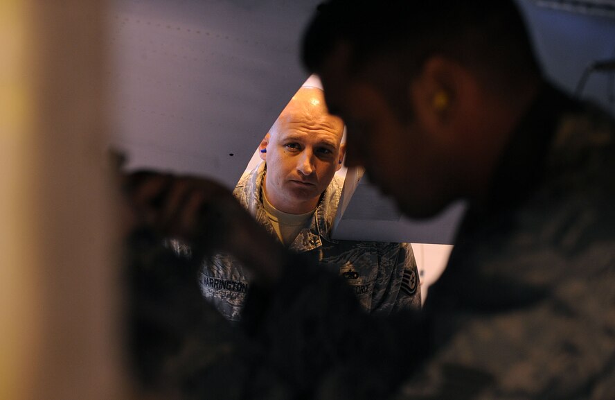 MOODY AIR FORCE BASE Ga. -- Tech. Sgt. Terry Harrington, 75th Aircraft Maintenance Unit load competition inspector, observes 75th AMU crew members during the 2009 Annual Load Crew Competition here Feb. 12. Each team is inspected by two members who observe the competitors’ progress and ensure proper procedures are taken to load all of the munitions.  (U.S. Air Force photo by Airman 1st Class Joshua Green)