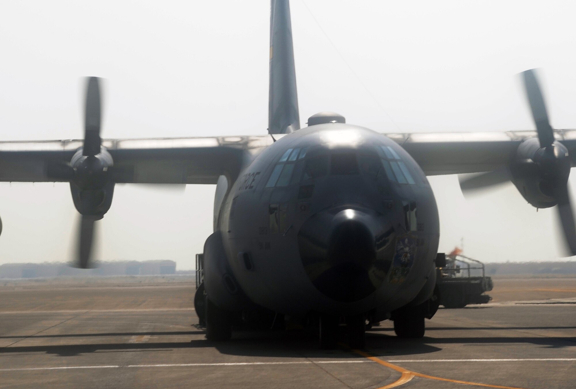 An Air Force Reserve C-130 Hercules and its crew, along with aerial port Airmen and maintenance Airmen, perform an "engines running off-load" at a non-disclosed base in Southwest Asia on Feb. 16, 2010.  The C-130, deployed from the 911th Airlift Wing at Pittsburgh, Penn., is one of the main airlift airplanes used in the U.S. Central Command area of responsibility moving tons of cargo and thousands of people every day. (U.S. Air Force Photo/Master Sgt. Scott T. Sturkol/Released) 