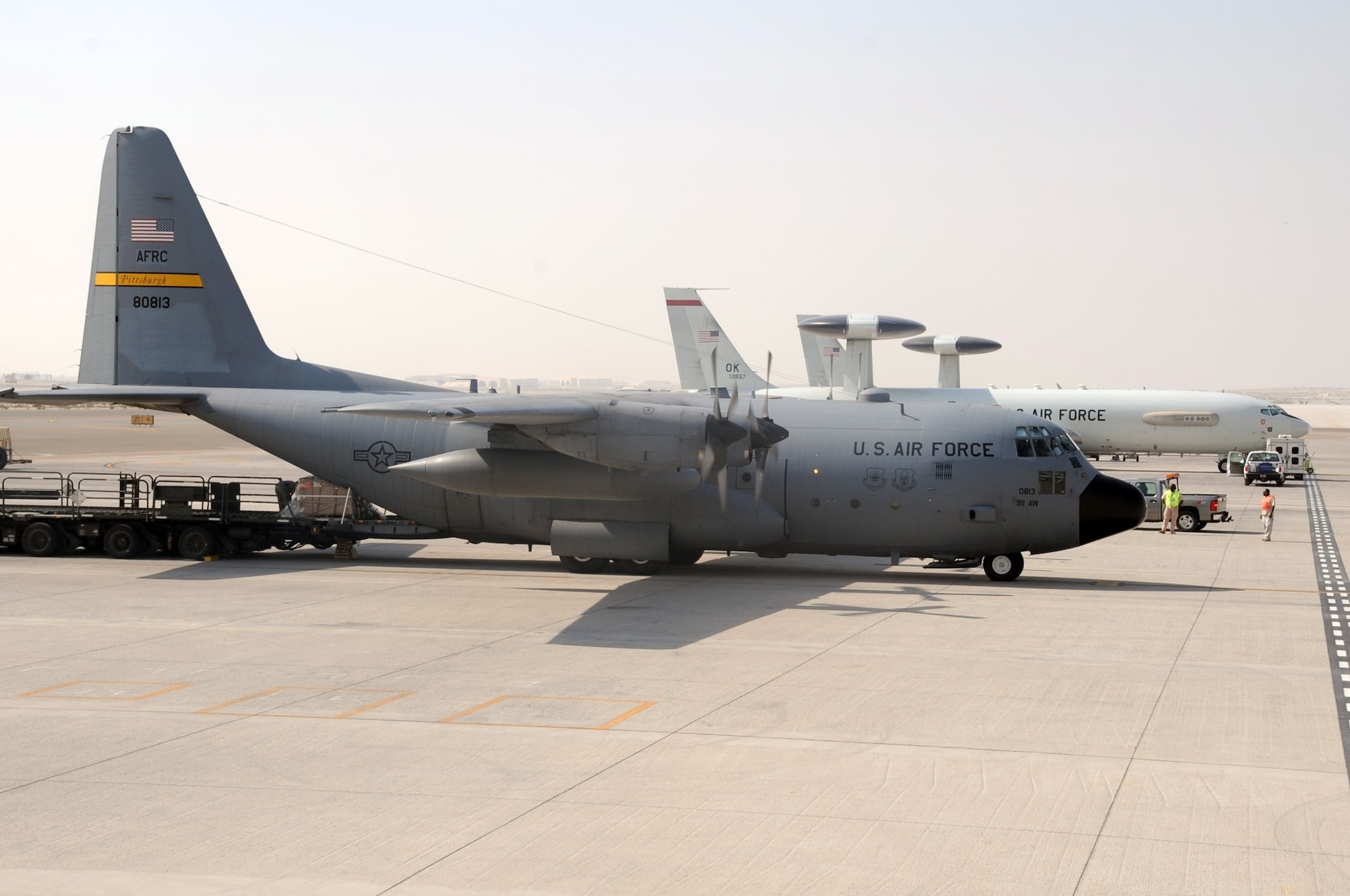 An Air Force Reserve C-130 Hercules and its crew, along with aerial port Airmen and maintenance Airmen, perform an "engines running off-load" at a non-disclosed base in Southwest Asia on Feb. 16, 2010.  The C-130, deployed from the 911th Airlift Wing at Pittsburgh, Penn., is one of the main airlift airplanes used in the U.S. Central Command area of responsibility moving tons of cargo and thousands of people every day. (U.S. Air Force Photo/Master Sgt. Scott T. Sturkol/Released) 