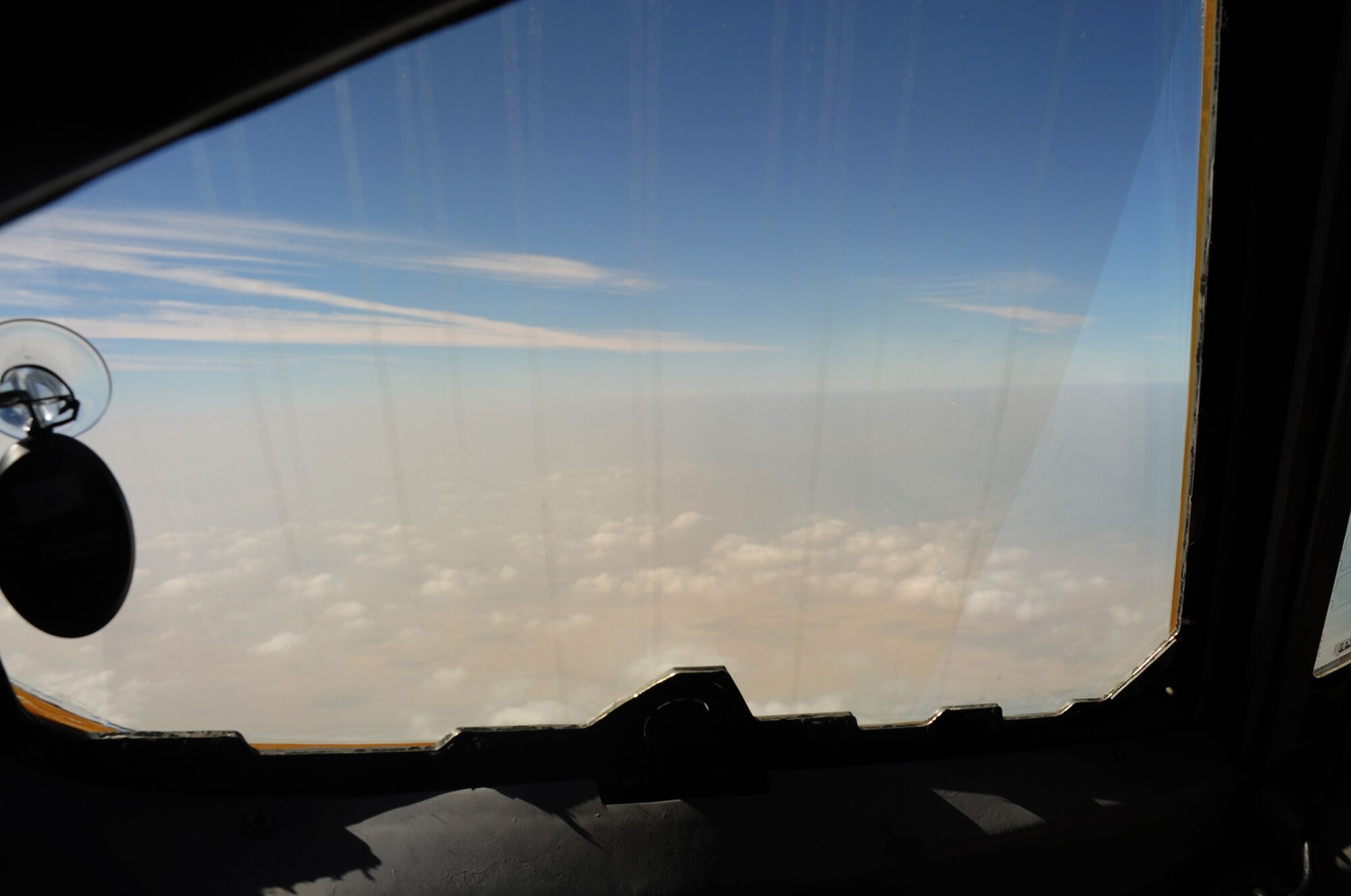 Through the window of an E-3 Sentry Airborne Warning and Control System aircraft, the landscape of a non-disclosed location in Southwest Asia is shown as the E-3 gains altitude during a combat air mission Feb. 16, 2010. The E-3 is assigned to the 965th Expeditionary Airborne Air Control Squadron at a non-disclosed base in Southwest Asia.  The airplane is deployed to the region from Tinker Air Force Base, Okla. (U.S. Air Force Photo/Master Sgt. Scott T. Sturkol/Released)  
