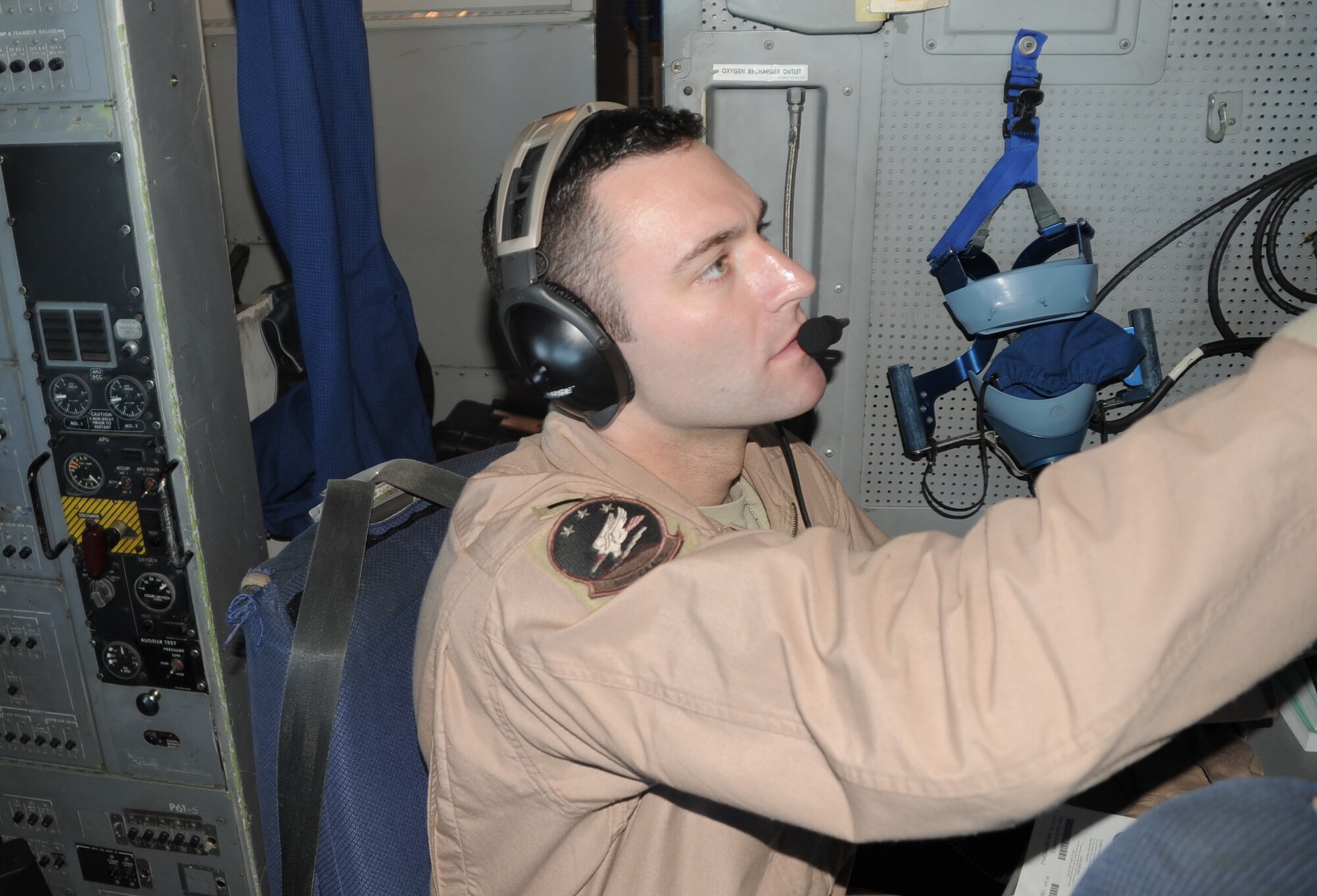 First Lt. Bradley Bentlage, E-3 Sentry Airborne Warning and Control System aircraft navigator with the 965th Expeditionary Airborne Air Control Squadron at a non-disclosed base in Southwest Asia, works the navigation console of an E-3 while on a combat air mission Feb. 16, 2010. Lieutenant Bentlage is deployed from Tinker Air Force Base, Okla. (U.S. Air Force Photo/Master Sgt. Scott T. Sturkol/Released)