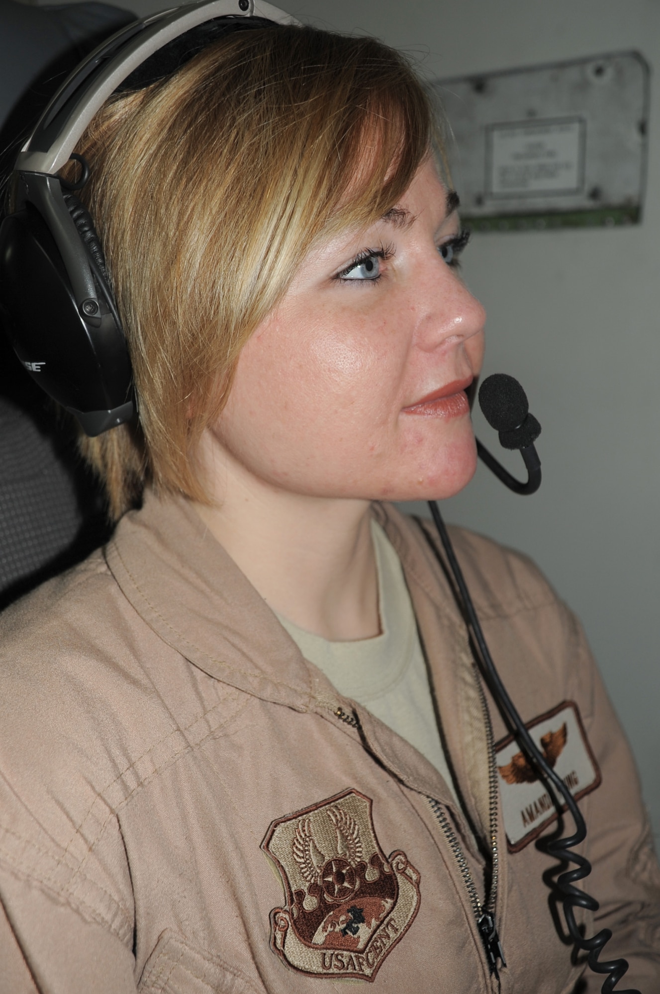 Capt. Amanda Young, an E-3 Sentry Airborne Warning and Control System aircraft air surveillance officer with the 965th Expeditionary Airborne Air Control Squadron, flies on a deployed E-3 air mission in Southwest Asia on Feb. 16, 2010. Captain Young is deployed from Tinker Air Force Base, Okla., and her hometown is Austin, Texas. (U.S. Air Force Photo/Master Sgt. Scott T. Sturkol/Released)