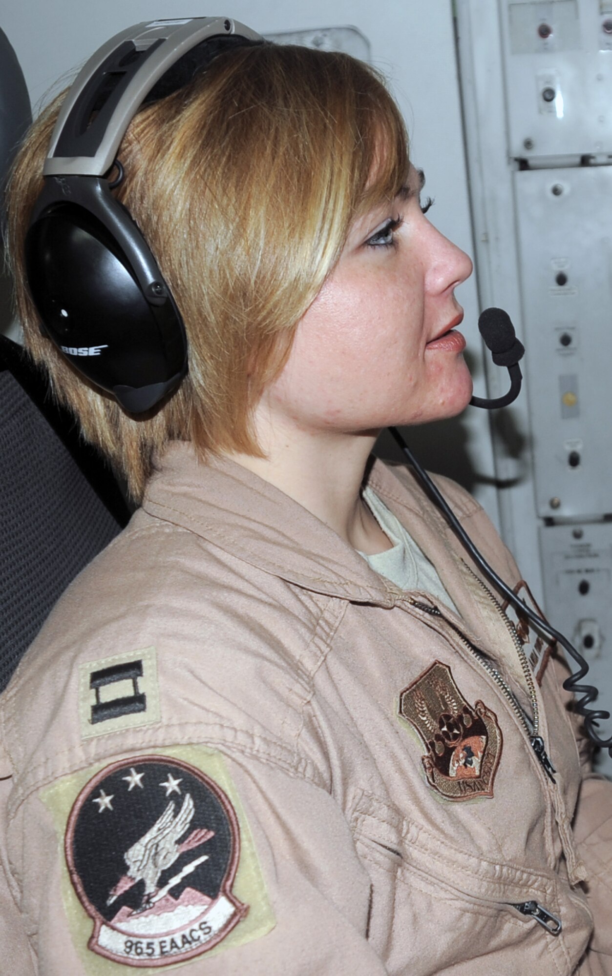 Capt. Amanda Young, an E-3 Sentry Airborne Warning and Control System aircraft air surveillance officer with the 965th Expeditionary Airborne Air Control Squadron, flies on a deployed E-3 air mission in Southwest Asia on Feb. 16, 2010. Captain Young is deployed from Tinker Air Force Base, Okla., and her hometown is Austin, Texas. (U.S. Air Force Photo/Master Sgt. Scott T. Sturkol/Released)