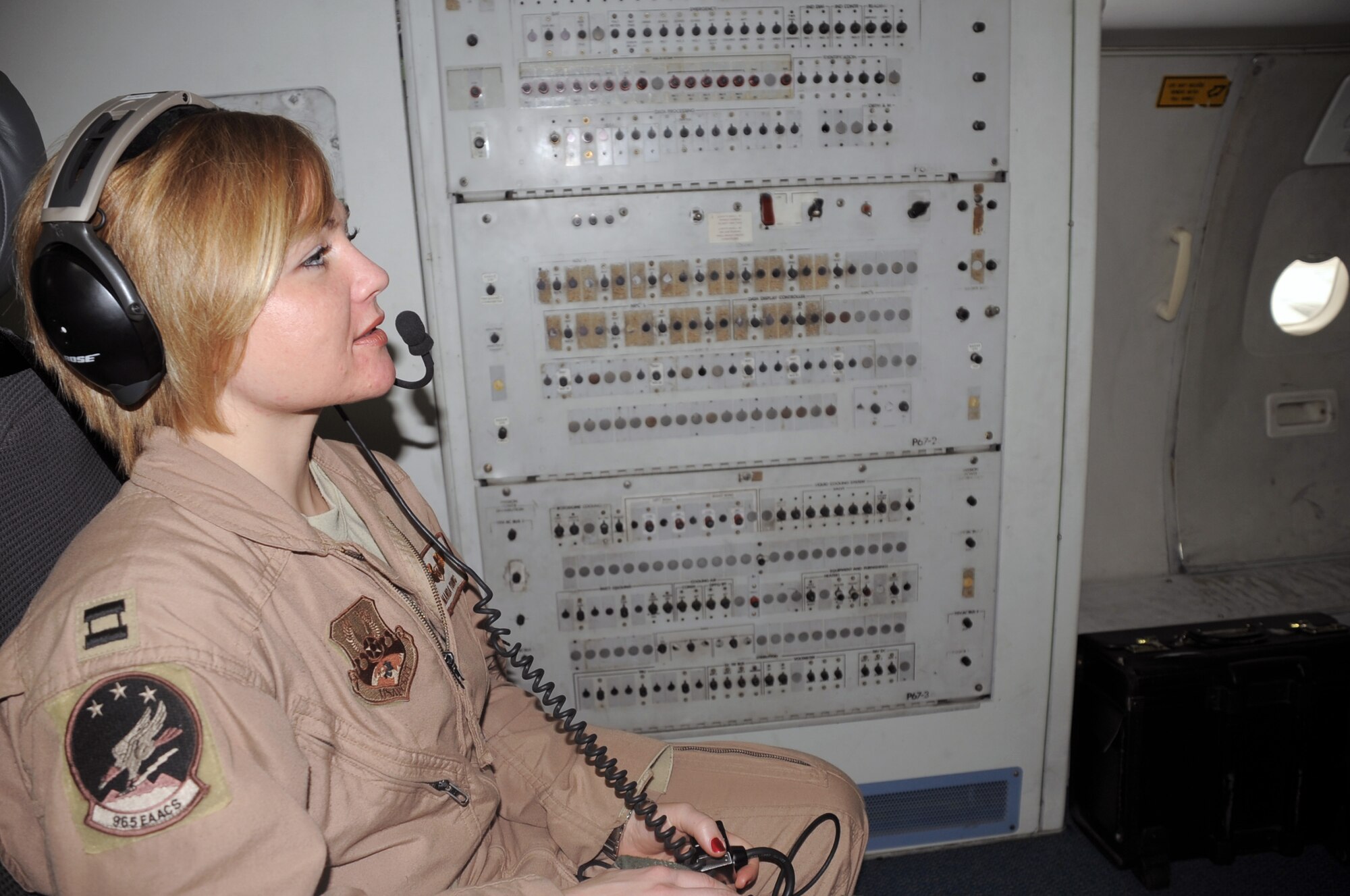 Capt. Amanda Young, an E-3 Sentry Airborne Warning and Control System aircraft air surveillance officer with the 965th Expeditionary Airborne Air Control Squadron, flies on a deployed E-3 air mission in Southwest Asia on Feb. 16, 2010. Captain Young is deployed from Tinker Air Force Base, Okla., and her hometown is Austin, Texas. (U.S. Air Force Photo/Master Sgt. Scott T. Sturkol/Released)