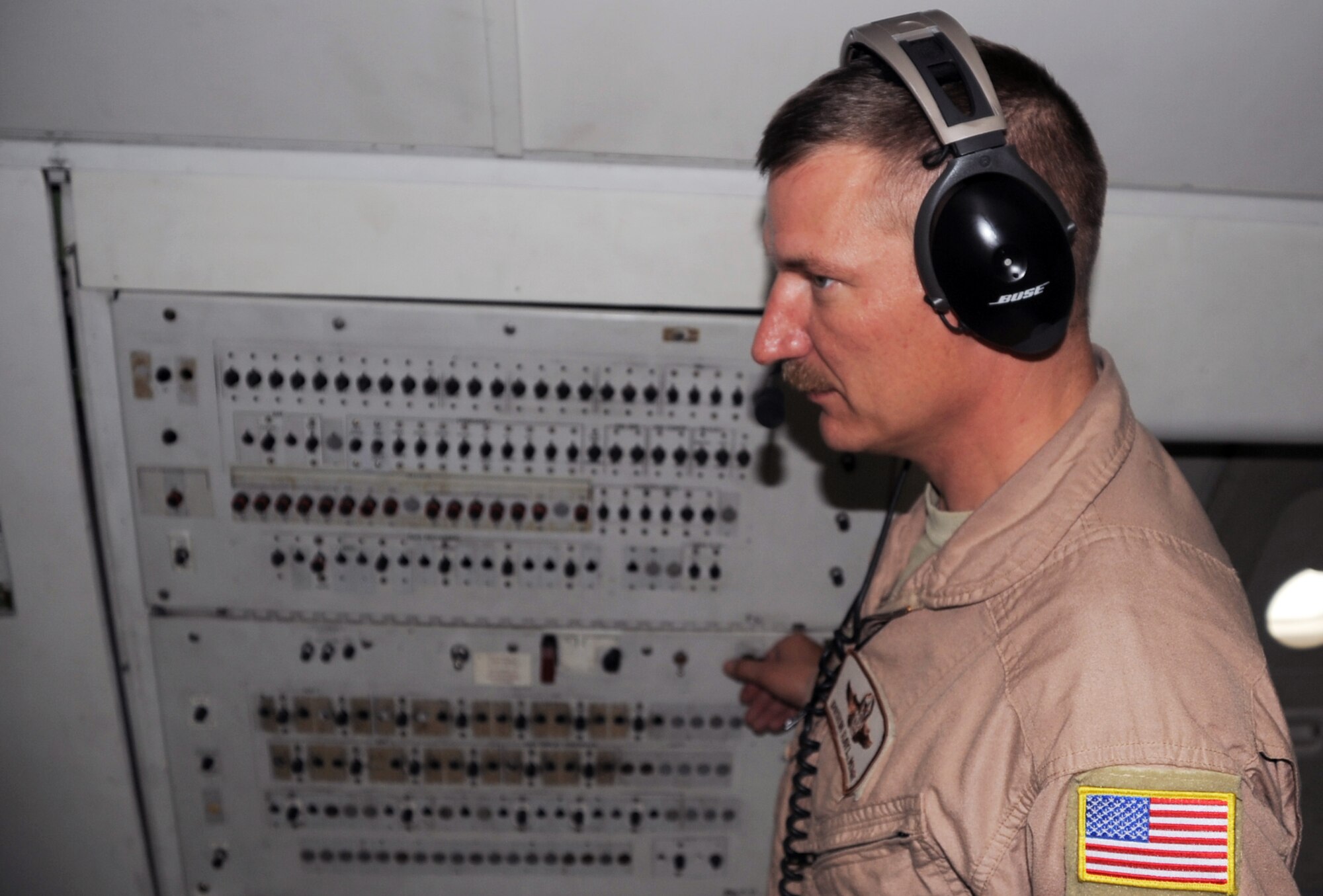 Master Sgt. Dustin Rayl, an E-3 Sentry Airborne Warning and Control System aircraft senior surveillance technician with the 965th Expeditionary Airborne Air Control Squadron, flies on a deployed E-3 air mission in Southwest Asia on Feb. 16, 2010. Sergeant Rayl is deployed from Tinker Air Force Base, Okla., and his hometown is Winston, Ore. (U.S. Air Force Photo/Master Sgt. Scott T. Sturkol/Released)