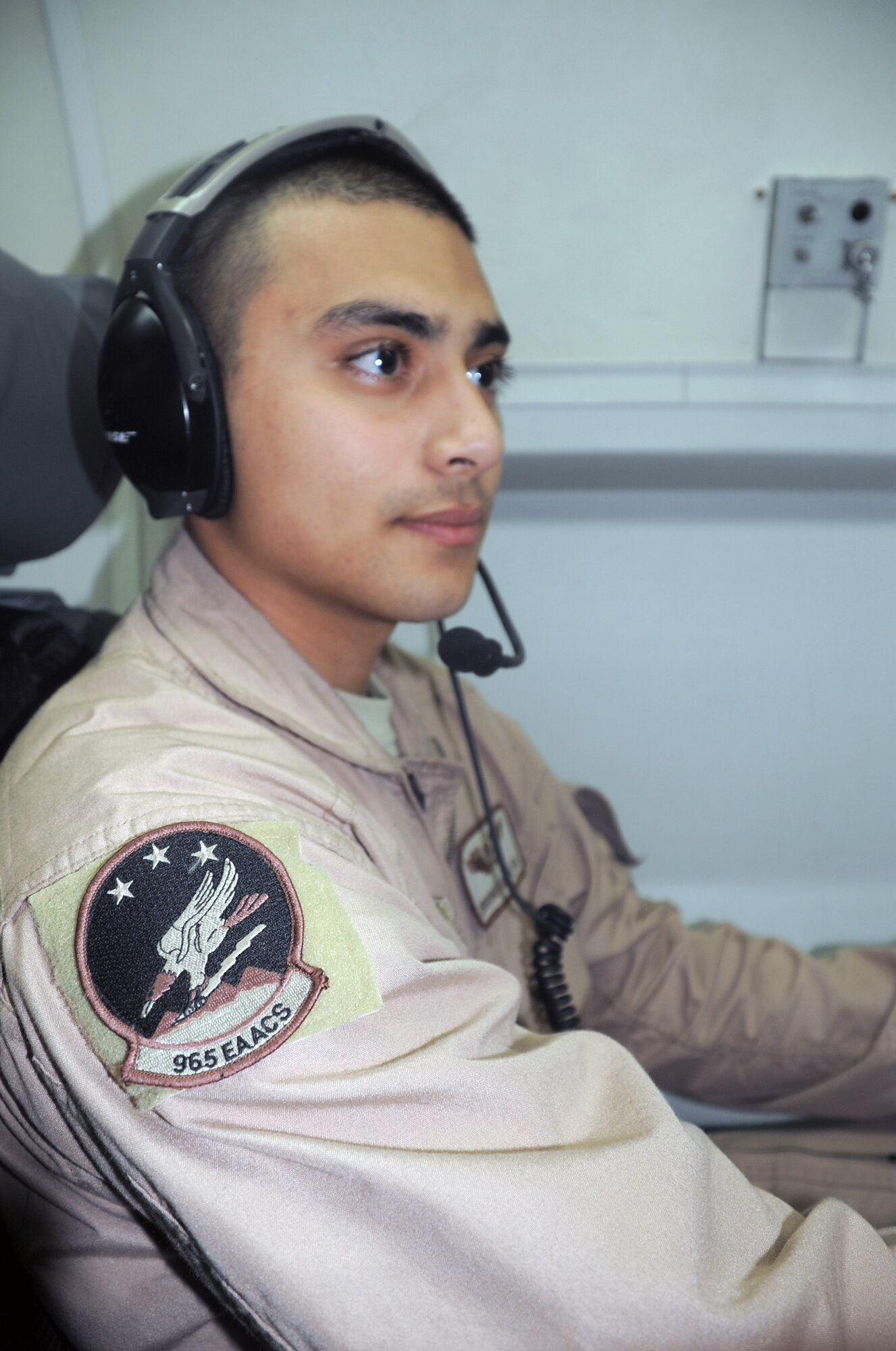 Senior Airman Jerrome Kamish, an E-3 Sentry Airborne Warning and Control System aircraft airborne radar technician with the 965th Expeditionary Airborne Air Control Squadron, flies on a deployed E-3 air mission in Southwest Asia on Feb. 16, 2010. Airman Williams is deployed from Tinker Air Force Base, Okla., and his hometown is Indianapolis, Ind. (U.S. Air Force Photo/Master Sgt. Scott T. Sturkol/Released)
