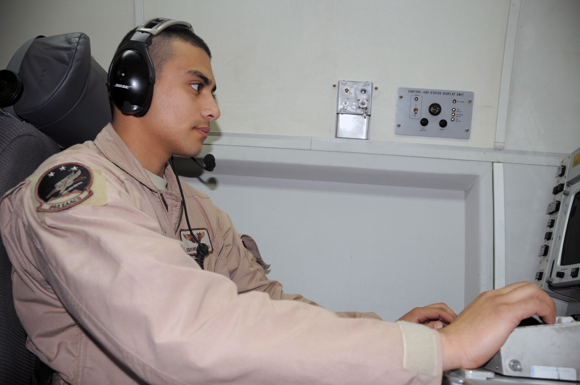 Senior Airman Jerrome Kamish, an E-3 Sentry Airborne Warning and Control System aircraft airborne radar technician with the 965th Expeditionary Airborne Air Control Squadron, flies on a deployed E-3 air mission in Southwest Asia on Feb. 16, 2010. Airman Williams is deployed from Tinker Air Force Base, Okla., and his hometown is Indianapolis, Ind. (U.S. Air Force Photo/Master Sgt. Scott T. Sturkol/Released)