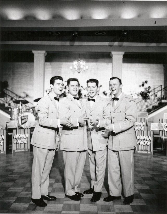 Vocal and instrumental group, “The Four Saints”.  Members are (left to right): John Howell, Doug Evans, Jerry DuChene, and Bob Erickson.  If you have any other stories you can share about the event, please email our Band Historian <a href="mailto:usafbandhistorian@afncr.af.mil">Technical Sgt. Tracey MacDonald</a>. Thank you and we look forward to hearing from you!  This is Photo 27. (Unknown Photo)