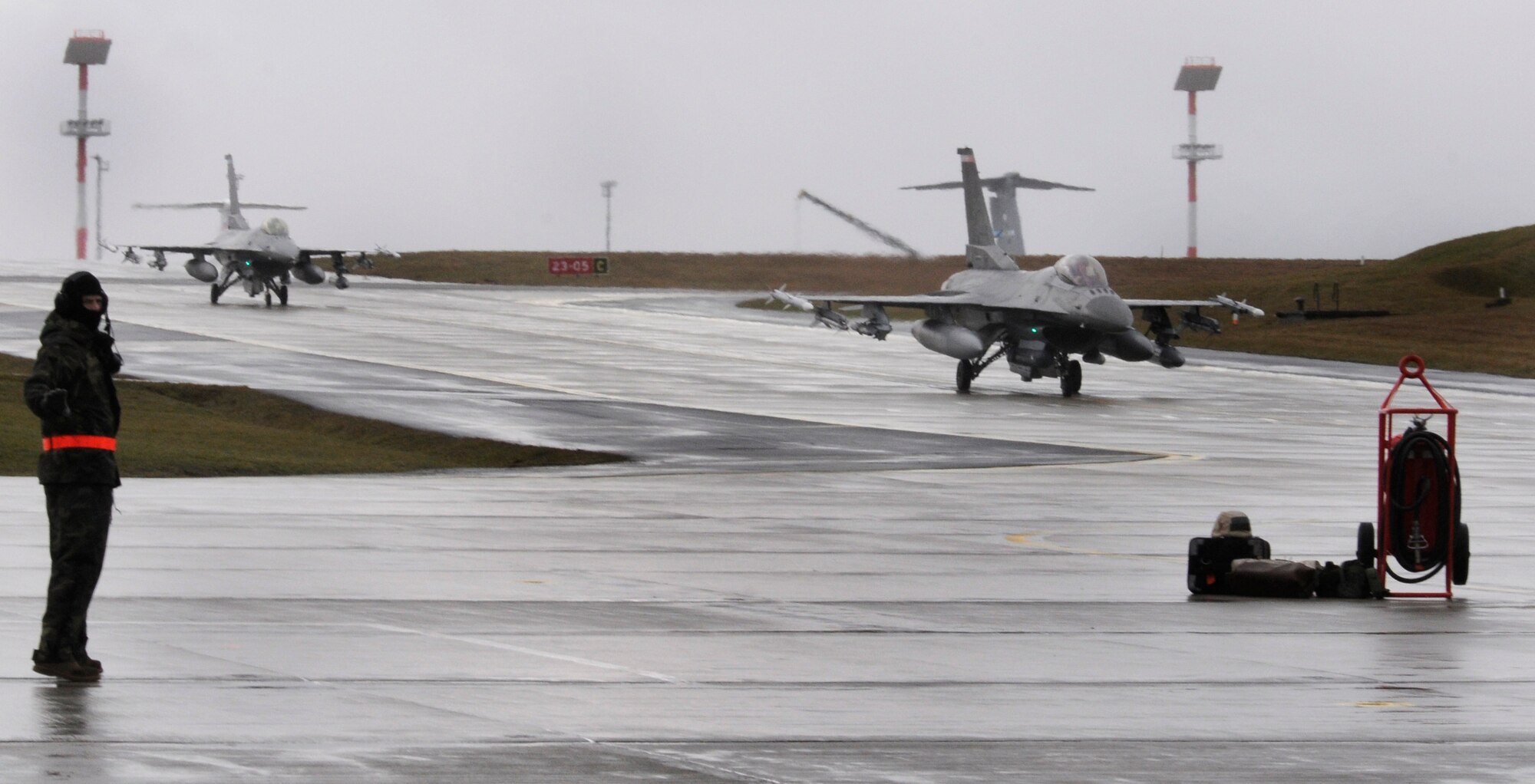 SPANGDAHLEM AIR BASE, Germany – F-16 Fighting Falcons taxi in to be regenerated during Operation Saber Crown 10-04 Feb. 25. The exercise evaluated the wing’s ability to support short-notice deployments and prepare for the upcoming operation readiness inspection and NATO force evaluation this summer. (U.S. Air Force photo/Airman 1st Class Staci Miller)
