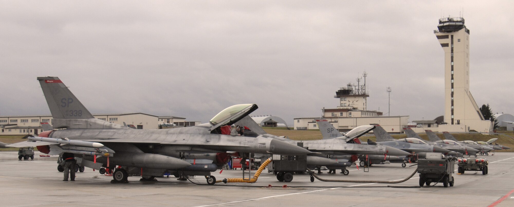 SPANGDAHLEM AIR BASE, Germany – F-16 Fighting Falcons sit on the flightline after flying a mission during Operation Saber Crown 10-04 Feb. 25. The exercise evaluated the wing’s ability to support short-notice deployments and prepare for the upcoming operation readiness inspection and NATO force evaluation this summer. (U.S. Air Force photo/Airman 1st Class Staci Miller)