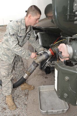 U.S Air Force Airman 1st Class Jason Rayner, 376th Expeditionary Logistics Readiness Squadron fuels journeyman, pumps JP8 into a petroleum, oil and lubricants fuel truck Feb. 26, 2010. The 376th ELRS POL Airmen deployed to the Transit Center at Manas, Kyrgyzstan, broke their own record Feb. 18 by pumping 544,758 gallons of jet fuel in a 24-hour period. The standing record, which the previous flight set Oct. 8, 2009, was 501,662 gallons in 24 hours. Airman Rayner, a Houston, Texas, native deployed from Altus Air Force Base, Okla., pumped 43,744 gallons that day. (U.S. Air Force photo/Senior Airman Nichelle Anderson/released)