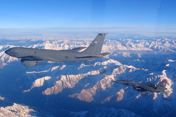 A 22nd Expeditionary Air Refueling Squadron KC-135 refuels a fighter jet over Afghanistan (date). The Stratotankers are refueled on the ground by 376th Expeditionary Logistics Readiness Squadron Airmen 24/7 so that they can provide midair refueling for the warfighter. Last week, the 376th ELRS petroleum, oil and lubricants fuels specialists broke a record pumping more than 544,000 gallons into these tankers, which in turn fuel the fight and protect troops on the ground. (Courtesy photo/released)