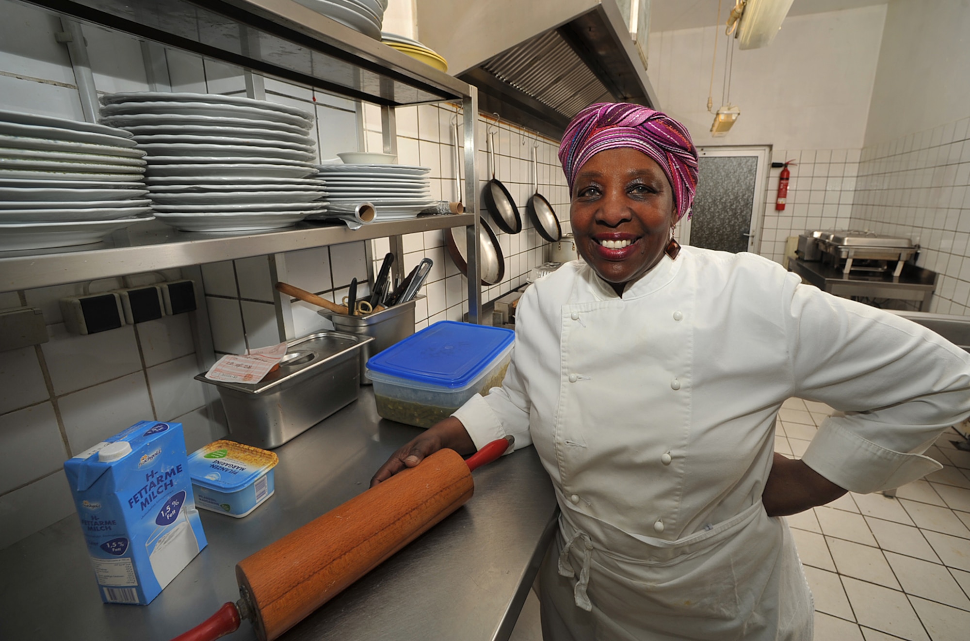 Brenda 'Mama' West, professional chef, poses for a photo in the kitchen of her restaurant, Ramstein village, Germany, Feb. 25, 2010. Mama West has been volunteering her time and cooking skills to feed U.S. servicemembers and wounded warriors in the KMC for over a decade. (U.S. Air Force photo by Senior Airman Tony R. Ritter)