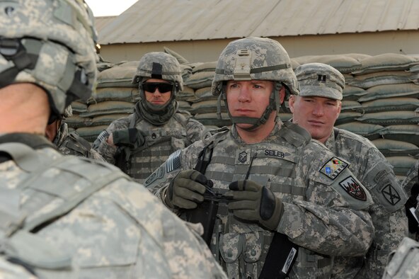 U.S. Air Force Master Sgt. Patrick Seiler, deployed with the U.S. Army's Combined Joint Task Force 82 Regional Support Team East, listens to a convoy brief, Jan. 19, 2010. Sergeant Seiler is a resource advisor, and is deployed from the Air Force Financial Services Center, Ellsworth Air Force Base, S.D. (U.S. Air Force Photo by/ Staff Sgt. Richard Williams)