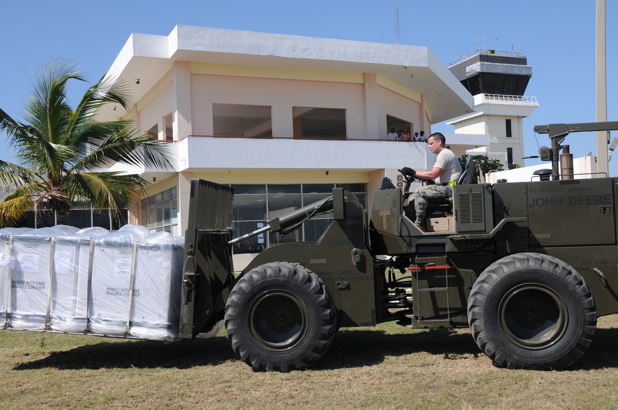 Staff Sgt. Ray Graves of the Kentucky Air National Guard?s 123rd Contingency Response Group loads life-saving plasma onto a truck at an air hub in Barahona, Dominican Republic,  Jan. 24. The truck is enroute to earthquake-damaged Haiti. (U.S. Air Force photo by Tech. Sgt. Dennis Flora)