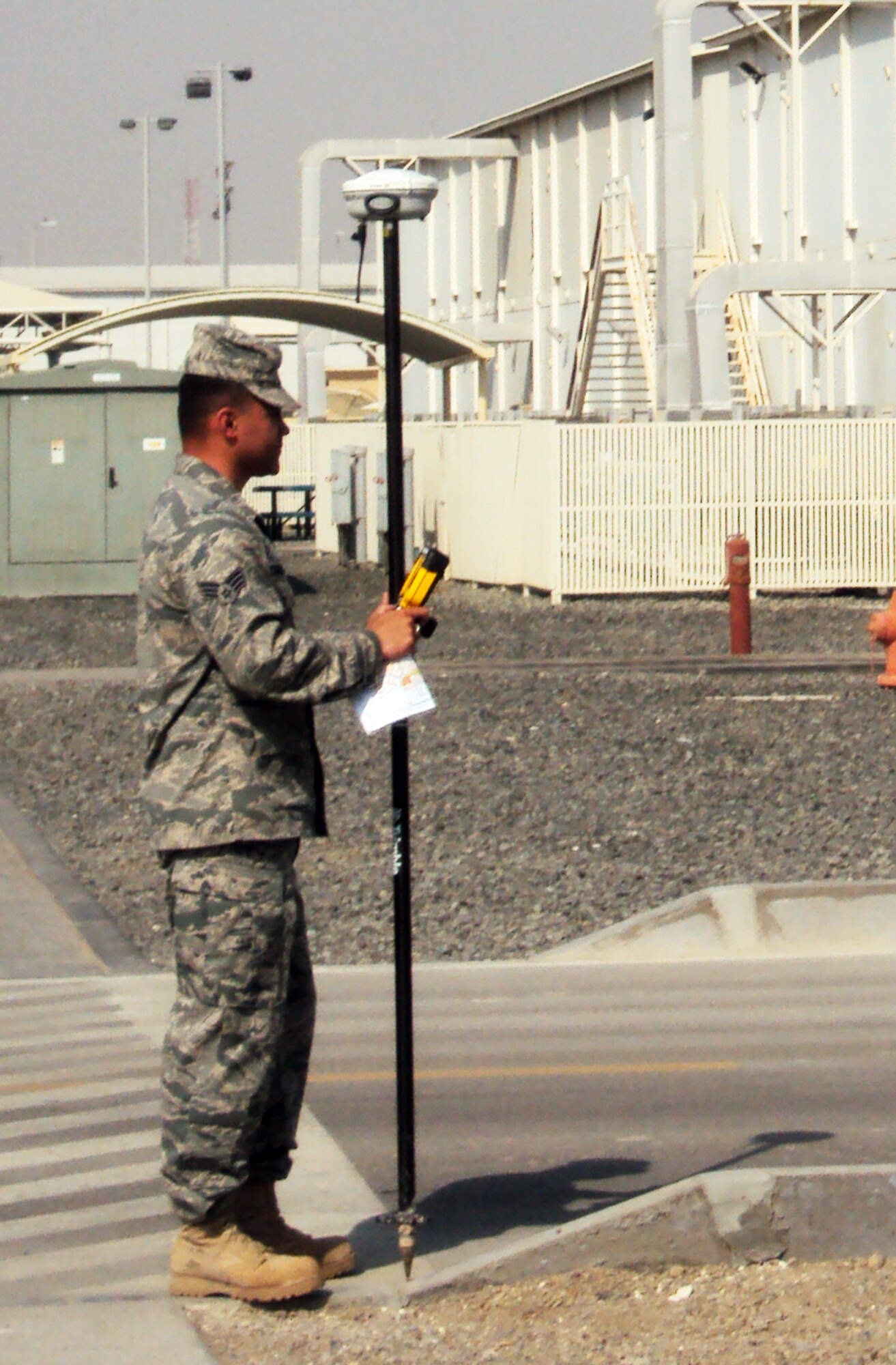 An Airman from the 380th Expeditionary Civil Engineer Squadron plots global positioning points in the wing's camp area during operations at a non-disclosed base in Southwest Asia on Feb. 22, 2010.  (U.S. Air Force Photo/Master Sgt. Scott T. Sturkol/Released)