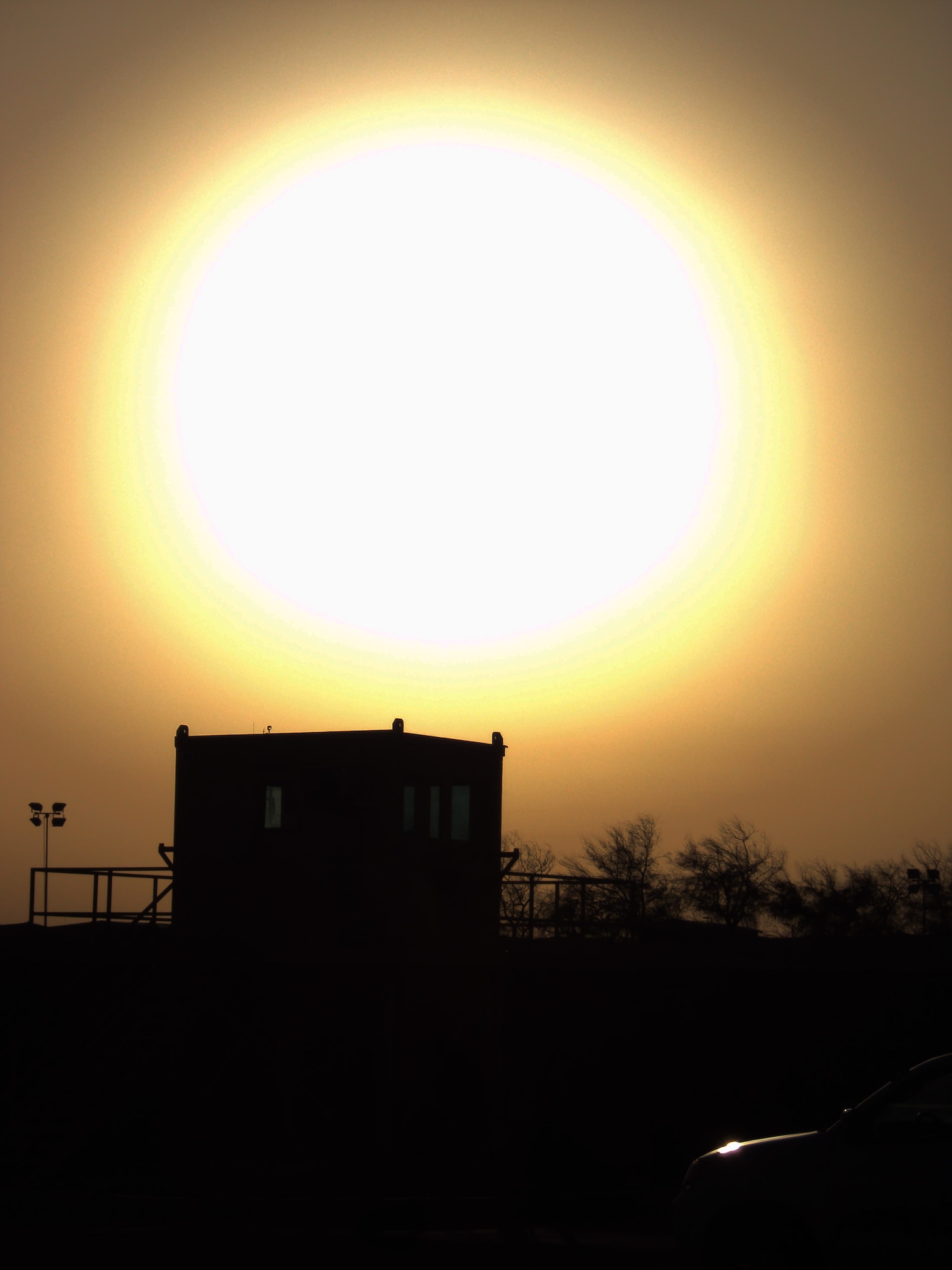 The sun sets over the camp of the 380th Air Expeditionary Wing on Feb. 9, 2010, at a non-disclosed base in Southwest Asia.  The 380th AEW supports operations Iraqi Freedom and Enduring Freedom and the Combined Joint Task Force-Horn of Africa.  (U.S. Air Force Photo/Master Sgt. Scott T. Sturkol)