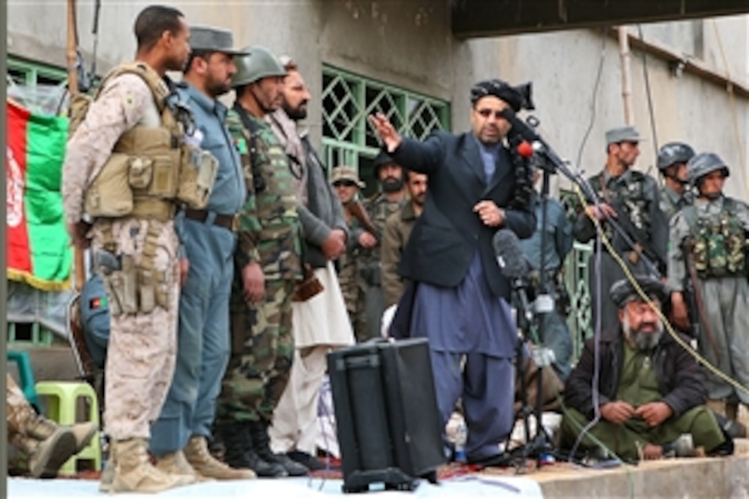 Gulab Mangal, governor of Helmand province, Afghanistan, pays credit to U.S. and Afghan leadership responsible for the improved security in the city of Marja, Afghanistan, Feb. 25, 2010. Officials raised the Afghan flag over the town for the first time since insurgents infiltrated the city years ago. 