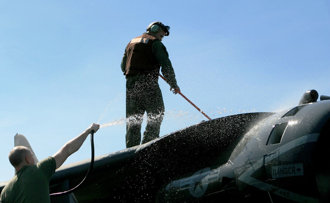 Marines with Marine Attack Squadron 311 (VMA-311), 31st Marine Expeditionary Unit (MEU), wash an AV-8B Harrier II for a weekly inspection aboard the forward-deployed amphibious assault ship USS Essex (LHD-2), Feb. 26. VMA-311 is the fixed-wing attack component of the Aviation Command Element (ACE) attached to the MEU. The MEU recently completed Exercise Cobra Gold 2010 (CG ’10) and is currently scheduled to go underway to the Republic of the Philippines in support of Exercise Balikatan 2010 (BK ’10).