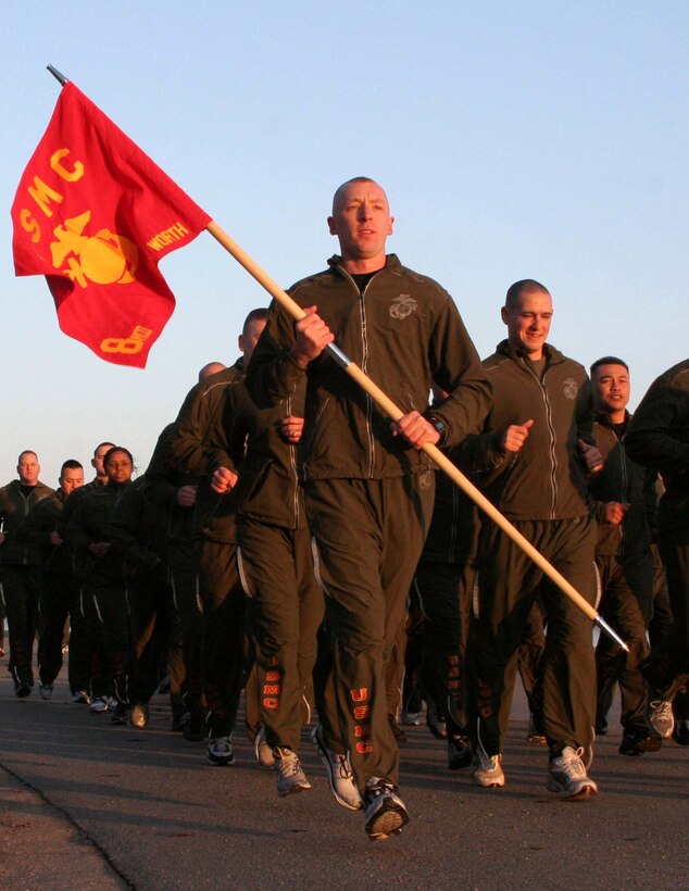 NAVAL AIR STATION JOINT RESERVE BASE FORT WORTH, Texas (Feb. 29, 2009) -- Sgt. Jonathan Batzlaff and other Marines of Recruiting Station Fort Worth run through the street during physical training here. This was the first time the Marines, also known as the "Spartans," were able to get all 80 troops together for PT. (U.S. Marine Corps photo by Sgt. Ray Lewis)