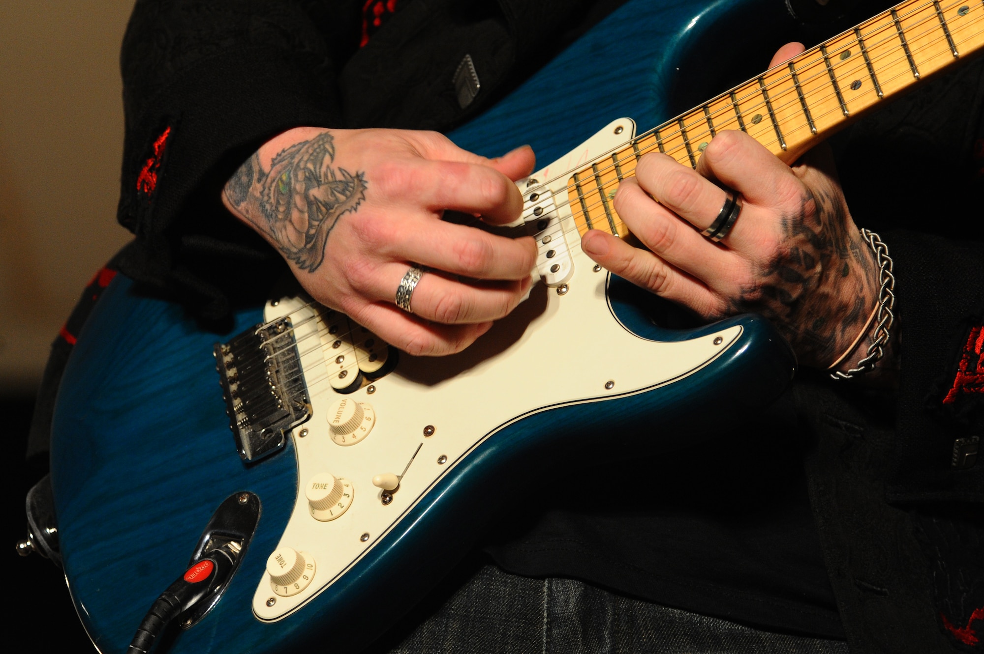 A Saving Abel guitarist performs during a USO-sponsored concert for servicemembers at a non-disclosed Southwest Asia location Feb. 22, 2010. (U.S. Air Force photo by Senior Airman Kasey Zickmund)[RELEASED]