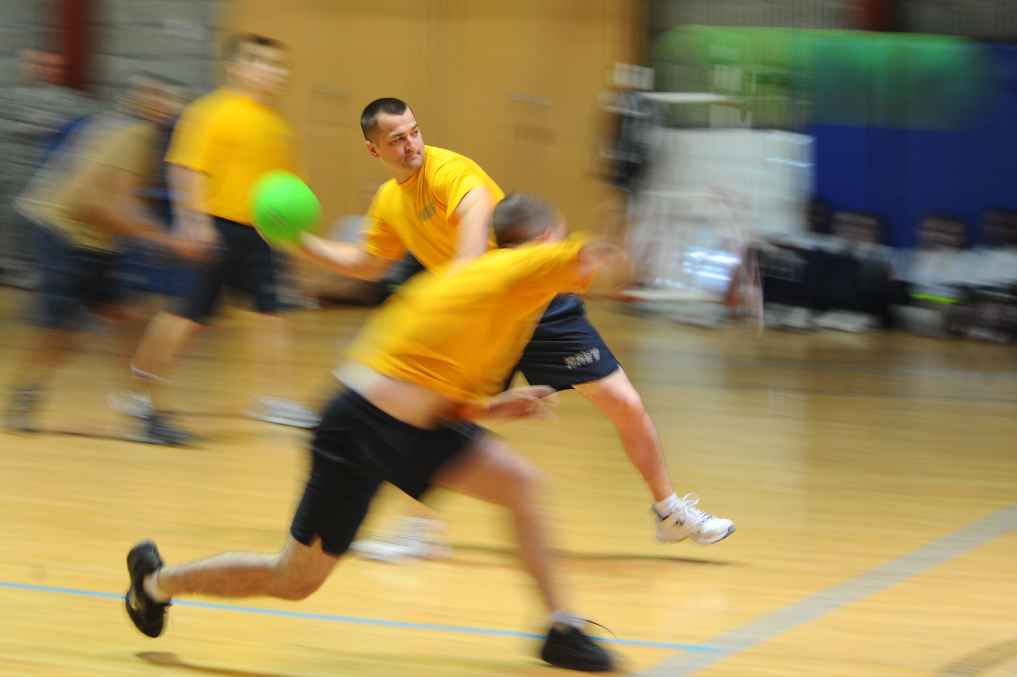 Navy Sailors throw dodgeballs during the first of 10 Commander?s Cup Challenge events at a non-disclosed Southwest Asia Feb. 23, 2010. (U.S. Air Force photo by Senior Airman Kasey Zickmund)[RELEASED]