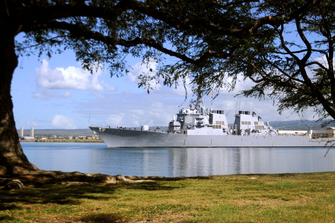 The guided-missile destroyer USS O'Kane makes its way out of Pearl Harbor as the state of Hawaii prepares for a possible tsunami generated by an 8.8-magnitude earthquake near Chile. U.S. Navy photo by Petty Officer 1st Class Mark Logico