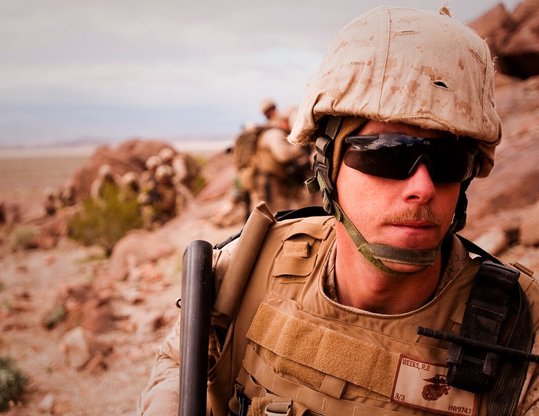 Lance Cpl. Raymond Weeks, a Marine with India Company, 3rd Battalion, 3rd Marine Regiment, makes his way up Machine Gun Hill during a company assault exercise at Range 400 at Marine Corps Air Ground Combat Center Twentynine Palms, Calif. Feb. 28.