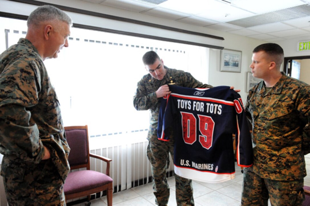 Petty Officer 3rd Class Charles White, Search and Rescue corpsman at the Marine Corps Air Station in Yuma, Ariz., rappels to Bobby Brown, 17, a local Yuma resident, after Brown's accident in the Gila Mountains of Arizona Feb. 27, 2010. During a hike, Brown fell breaking the joint of his right thumb and severing nerves in his right hand.