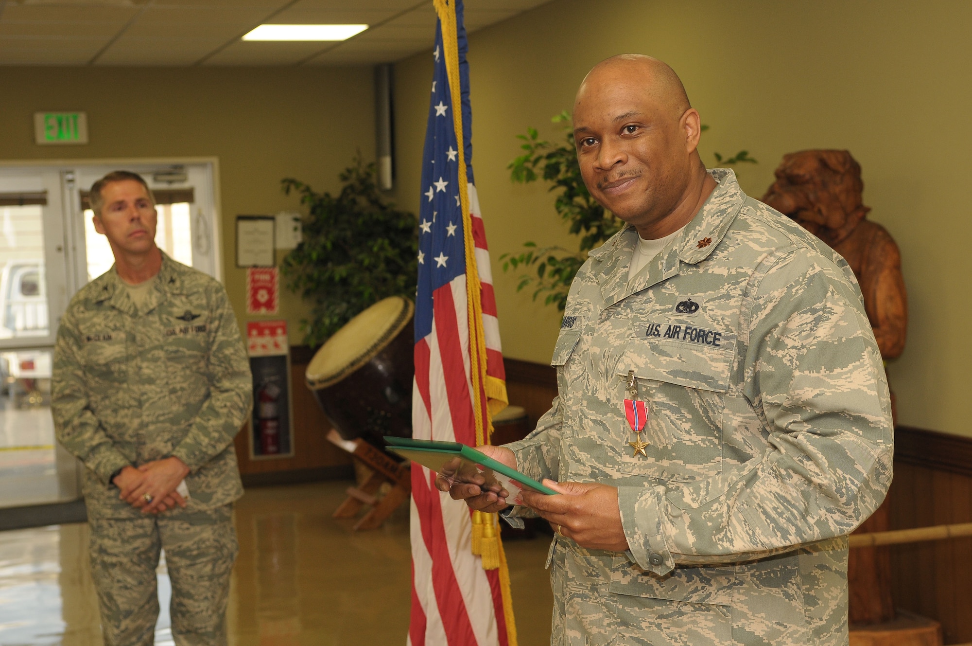 YOKOTA AIR BASE, Japan -- Maj. Derek Harris, 730th Air Mobility Squadron director of operations, says a few words Feb. 25 during his Bronze Star presentation ceremony. The Bronze Star Medal is awarded to individuals for acts of heroism or meritorious achievement in ground combat. (U.S. Air Force photo/Airman 1st Class Sean Martin)