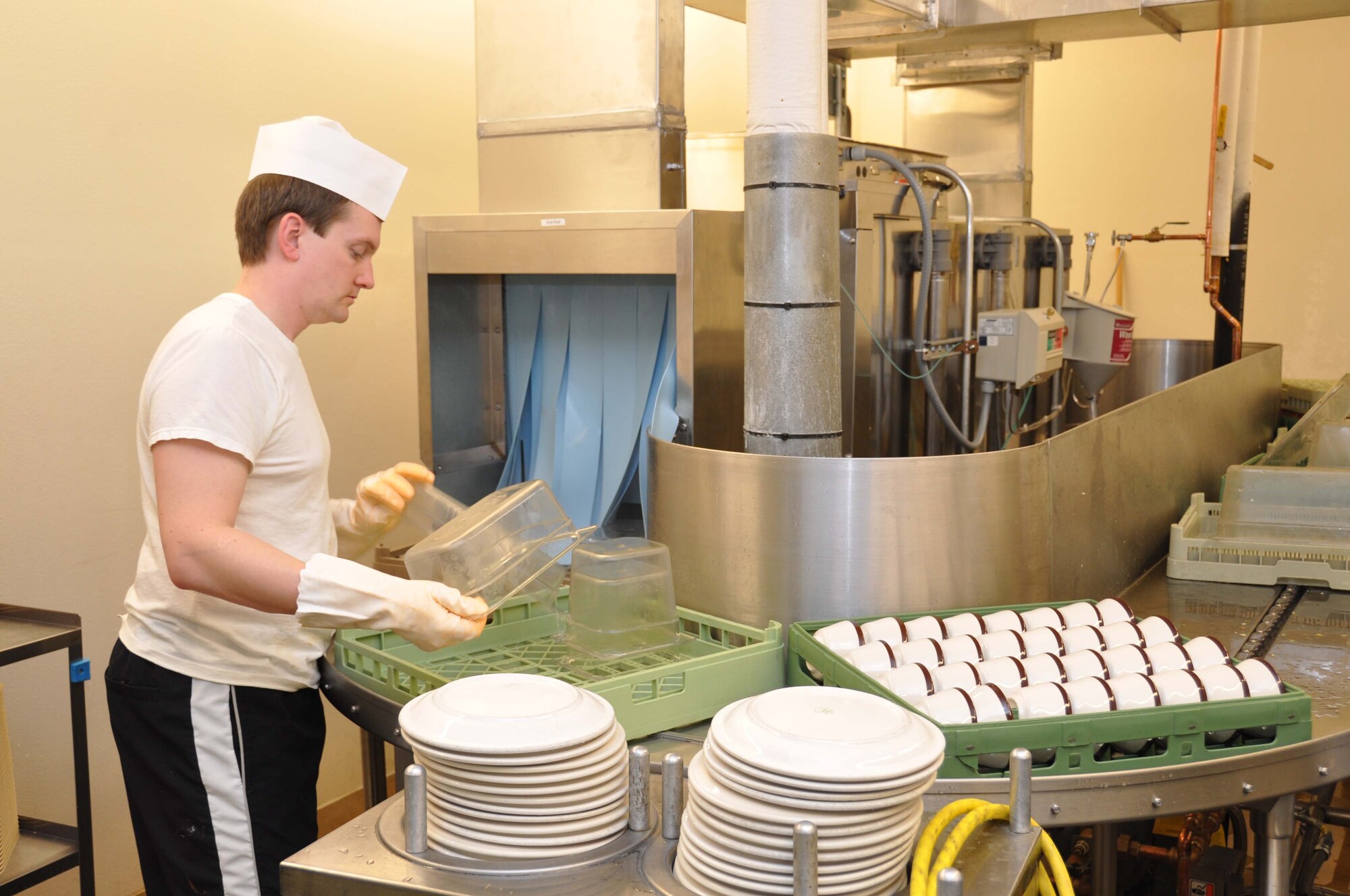 Jacob Gubrud, 934th Services Squadron, pulls dishes from the new dishwasher at the 934th Dining Facility, Feb. 7. The new washer provides higher capacity and quicker turnaround during Unit Training Assemblies. (Air Force photo/Senior Airman Noah R. Johnson)