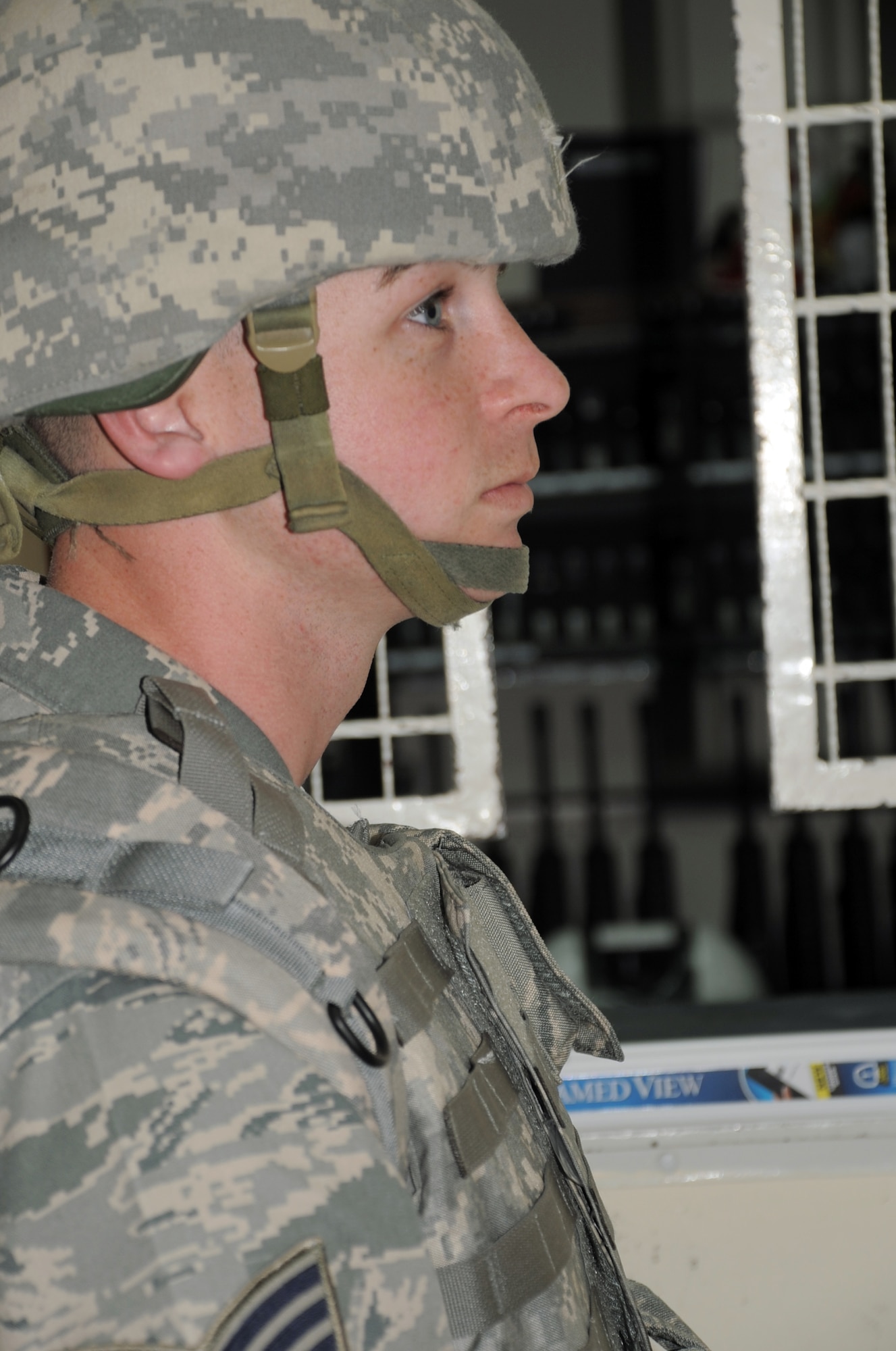 Staff Sgt. James Dees of the 380th Expeditionary Security Forces Squadron waits to be issued a weapon while wearing his protective armor during a security forces training exercise Feb. 20, 2010, at a non-disclosed base in Southwest Asia.  Sergeant Dees is deployed from the 87th Security Forces Squadron at Joint Base McGuire-Dix-Lakehurst, N.J. The 380th ESFS, as part of the 380th Air Expeditionary Wing, supports operations Iraqi Freedom and Enduring Freedom and the Combined Joint Task Force-Horn of Africa. (U.S. Air Force Photo/Master Sgt. Scott T. Sturkol/Released)