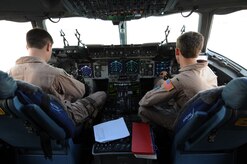 First Lt. Ed Sutton and 1st Lt. Mike Hunter conduct pre-flight checks prior to takeoff on a C-17 Globemaster III aircraft at a non-disclosed Southwest Asia location Feb. 15, 2010. The deployed officers arrived at their deployed location in late December. Lieutenants Sutton and Hunter are C-17 pilots with the 14th Airlift Squadron and are currently deployed to Southwest Asia with the 816th Expeditionary Airlift Squadron. (U.S. Air Force photo by Tech. Sgt. Michelle Larche)