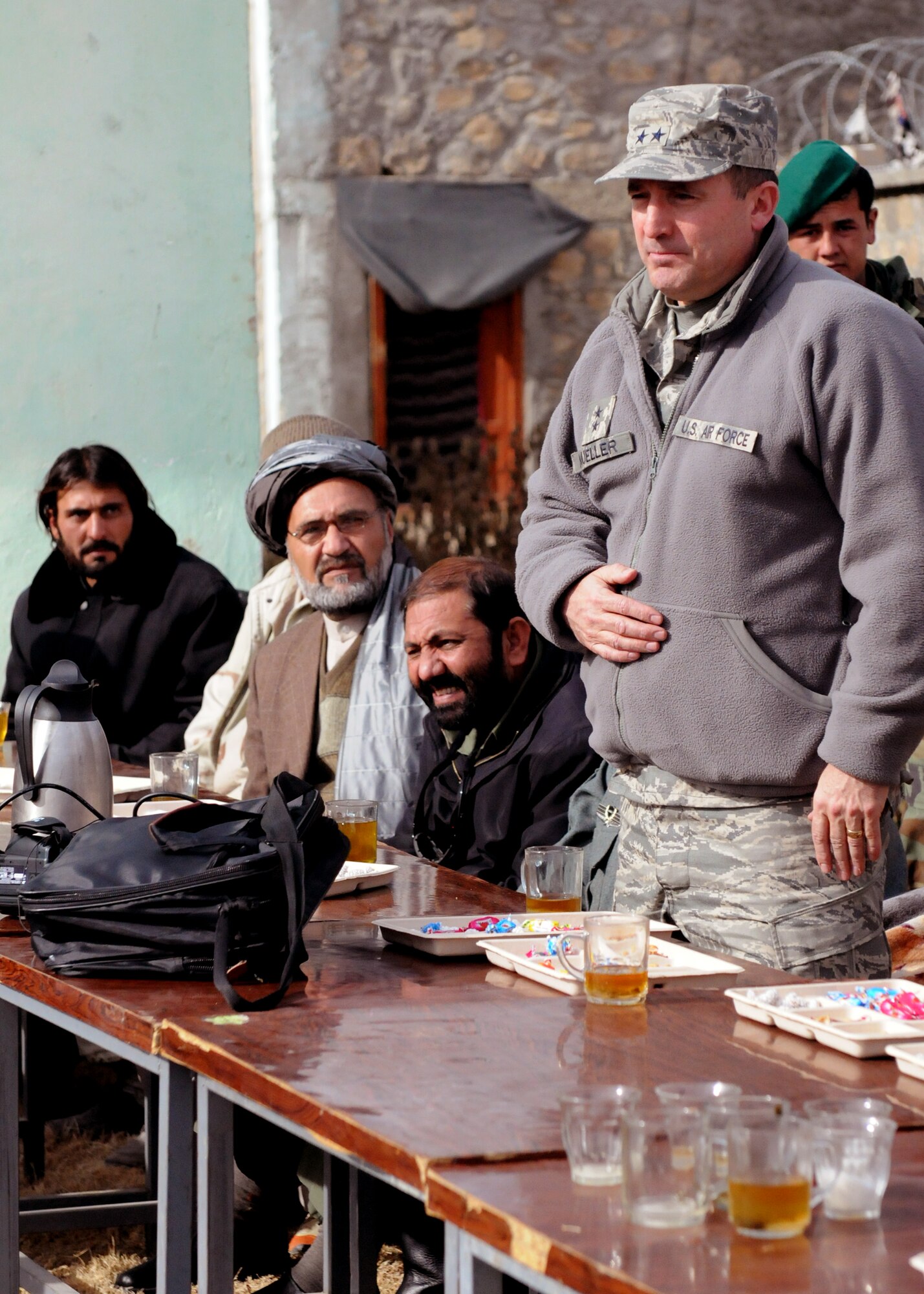 ZABUL PROVINCE, Afghanistan -- Maj. Gen. Stephen Mueller, U.S. Air Forces Central Air Component Coordination Element director, speaks to Afghan village elders prior to the opening ceremony of the Arghandab Bridge Dec. 26, 2009.  (U.S. Air Force photo/Master Sgt. Mary Hinson)