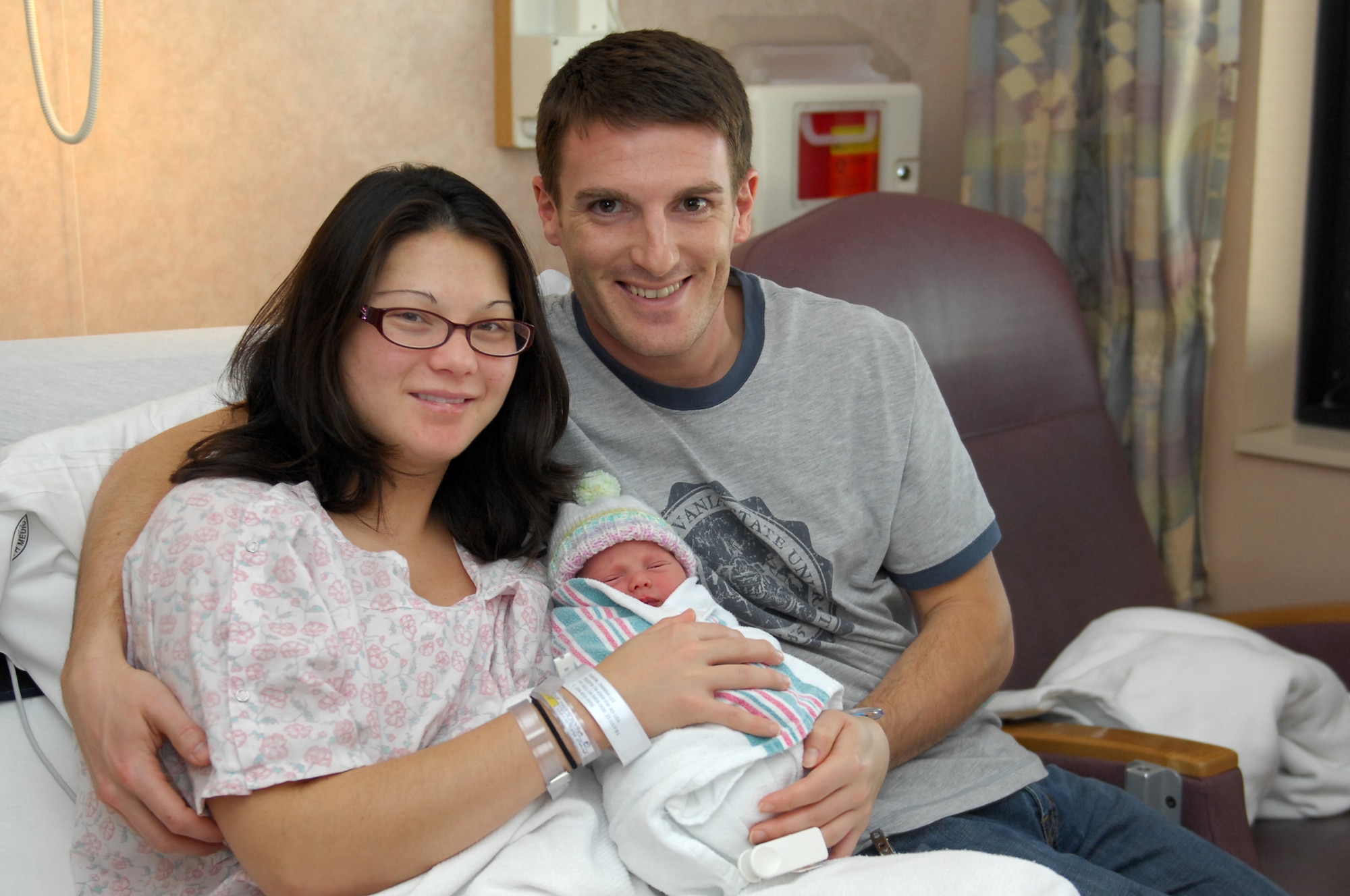 U.S. Army Capt. Ryan Gavin and his wife Dianna, hold their new daughter, Alexis LeAna Gavin, Jan. 1, 2010. Alexis is the first baby of the decade in the Las Vegas Valley and was born at Nellis Air Force Base's Mike O'Callaghan Federal Hospital at 12:30 a.m. on New Year's Day. She weighs 6 pounds, 10 ounces and measures 19.25 inches long. (U.S Air Force photo by Staff Sgt Taylor Worley)(Released)


