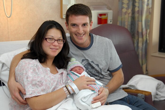 U.S. Army Capt. Ryan Gavin and his wife Dianna, hold their new daughter, Alexis LeAna Gavin, Jan. 1, 2010. Alexis is the first baby of the decade in the Las Vegas Valley and was born at Nellis Air Force Base's Mike O'Callaghan Federal Hospital at 12:30 a.m. on New Year's Day. She weighs 6 pounds, 10 ounces and measures 19.25 inches long. (U.S Air Force photo by Staff Sgt Taylor Worley)(Released)