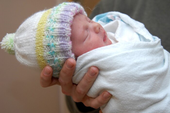 NELLIS AIR FORCE BASE, Nev. -- Alexis LeAna Gavin, daughter of U.S. Army Capt. Ryan Gavin and his wife Dianna, sleeps quietly in her father's arms Jan. 1, 2010 unaware that she is the first baby of the decade in the Las Vegas Valley.  Alexis was born at Nellis Air Force Base's Mike O'Callaghan Federal Hospital at 12:30 a.m. on New Year's Day.  She weighs 6 pounds, 10 ounces and measures 19.25 inches long.  (U.S Air Force photo by Staff Sgt Taylor Worley)(Released)

