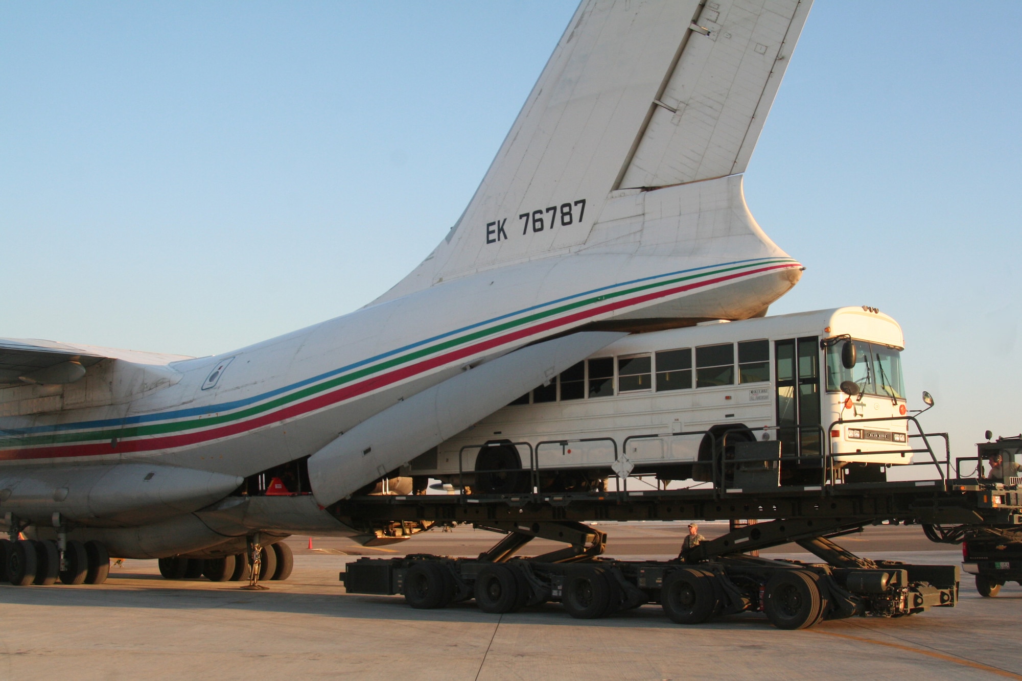 Air transportation Airmen assigned to the 380th Expeditionary Logistics Readiness Squadron Air Terminal Operations Center load a 44-passenger bus weighing more than 20,000 pounds onto a Russian-built IL-76 transport plane during operations at a non-disclosed base in Southwest Asia on Dec. 30, 2009. The bus was one of two that were loaded on the IL-76 for transport to Afghanistan. The 380th Air Expeditionary Wing supports Operations Iraqi Freedom and Enduring Freedom and the Combined Joint Task Force-Horn of Africa.  (U.S. Air Force Photo/Tech. Sgt. Scott T. Sturkol)