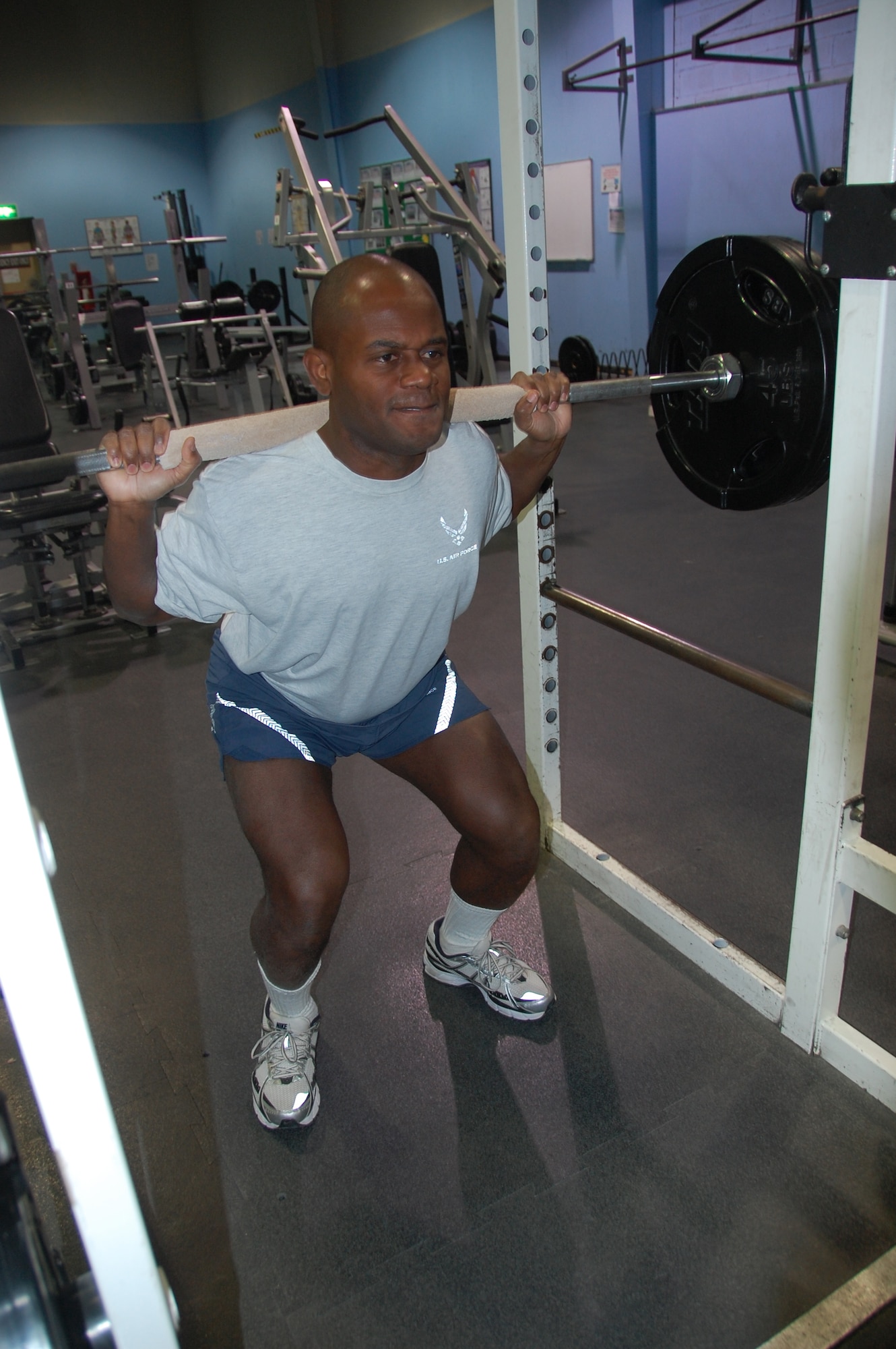 Col. John Williams, 586th Air Expeditionary Group commander, uses the squat press at the Rock Fitness Center at an air base in Southwest Asia Jan. 1, 2010. The colonel is one of many fitness center patrons focused on maintaining a healthy lifestyle and being "fit to fight". (U.S. Air Force photo/Staff Sgt. Lindsey Maurice)